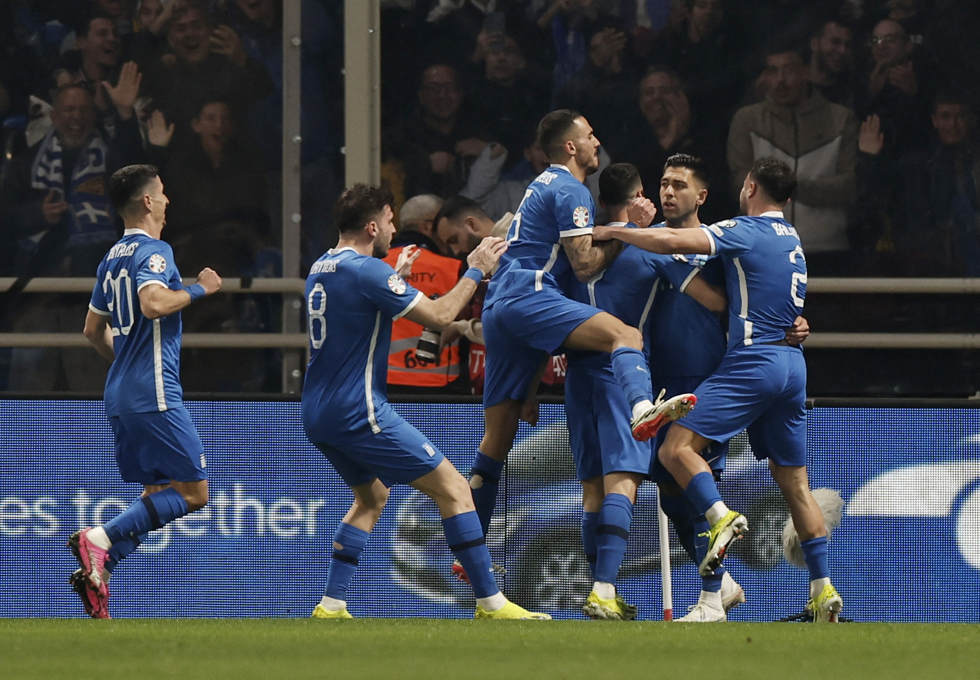 Soccer Football - Euro 2024 Qualifier - Play-Off - Greece v Kazakhstan - Agia Sophia Stadium, Athens, Greece - March 21, 2024 Greece's Anastasios Bakasetas celebrates scoring their first goal with teammates REUTERS