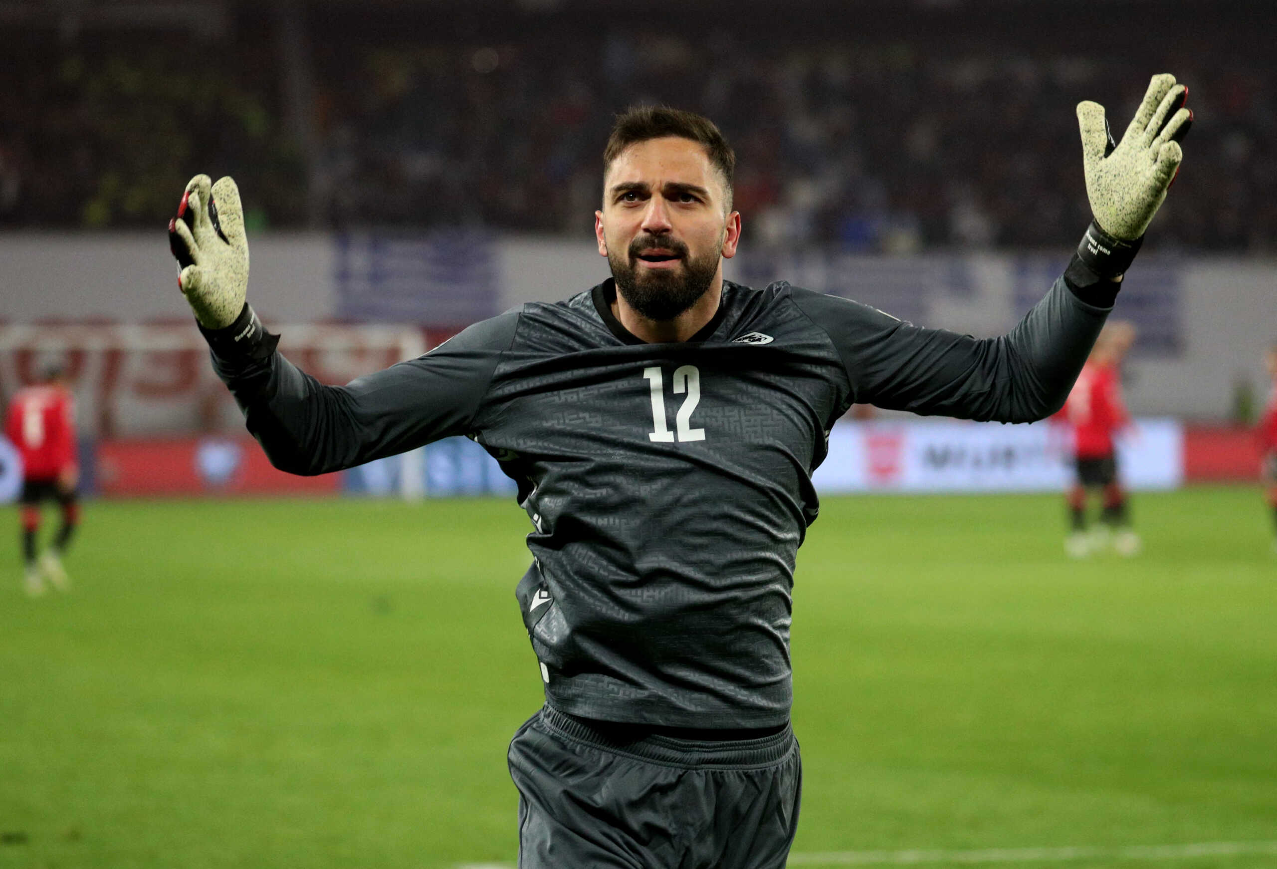 Soccer Football - Euro 2024 Qualifier - Play-off - Georgia v Greece - Boris Paichadze Dinamo Arena, Tbilisi, Georgia - March 26, 2024 Georgia's Giorgi Mamardashvili celebrates during the penalty shootout REUTERS