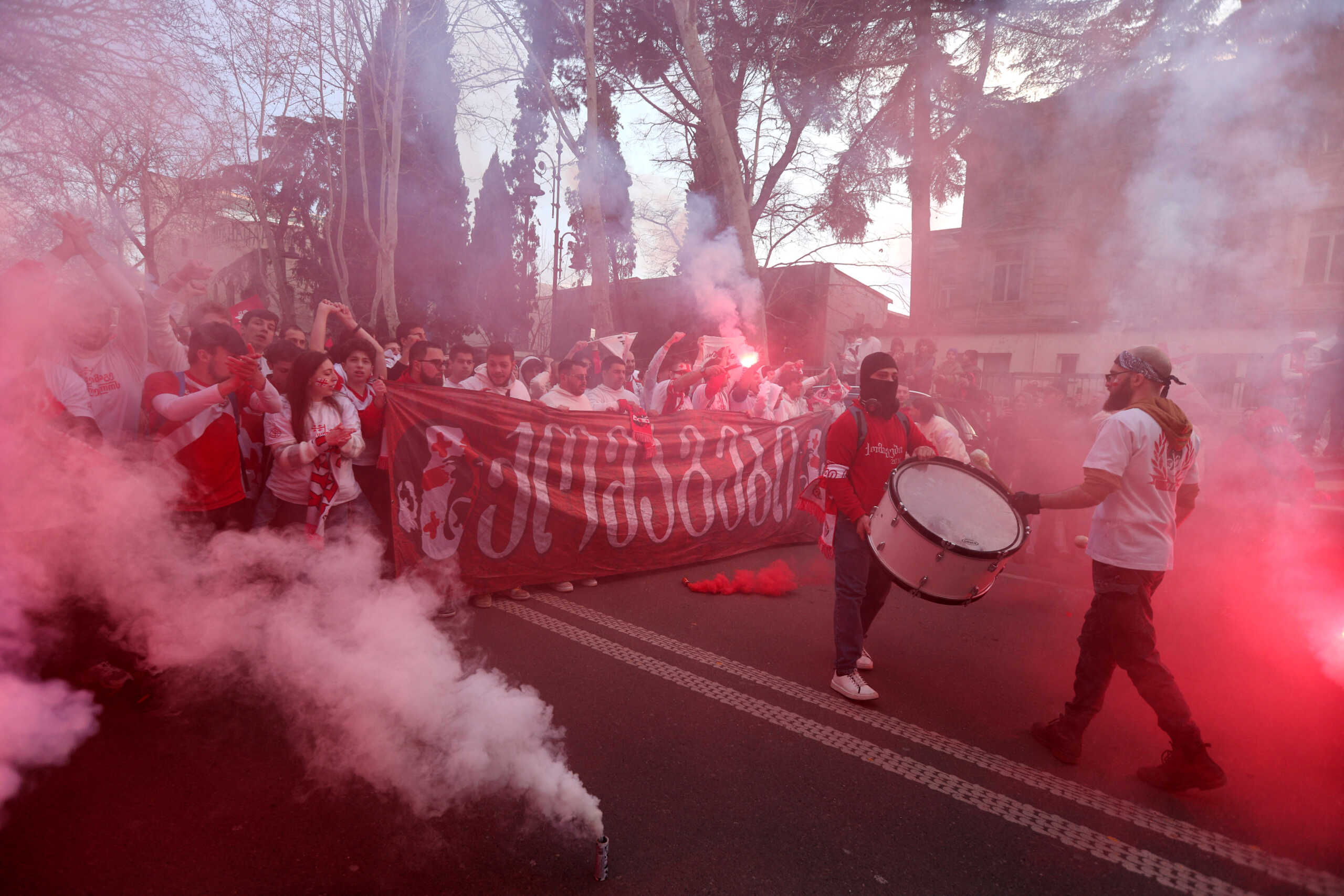 Soccer Football - Euro 2024 Qualifier - Georgia v Greece - Boris Paichadze Dinamo Arena, Tbilisi, Georgia - March 26, 2024 Georgia fans are seen with flares outside the stadium before the match REUTERS