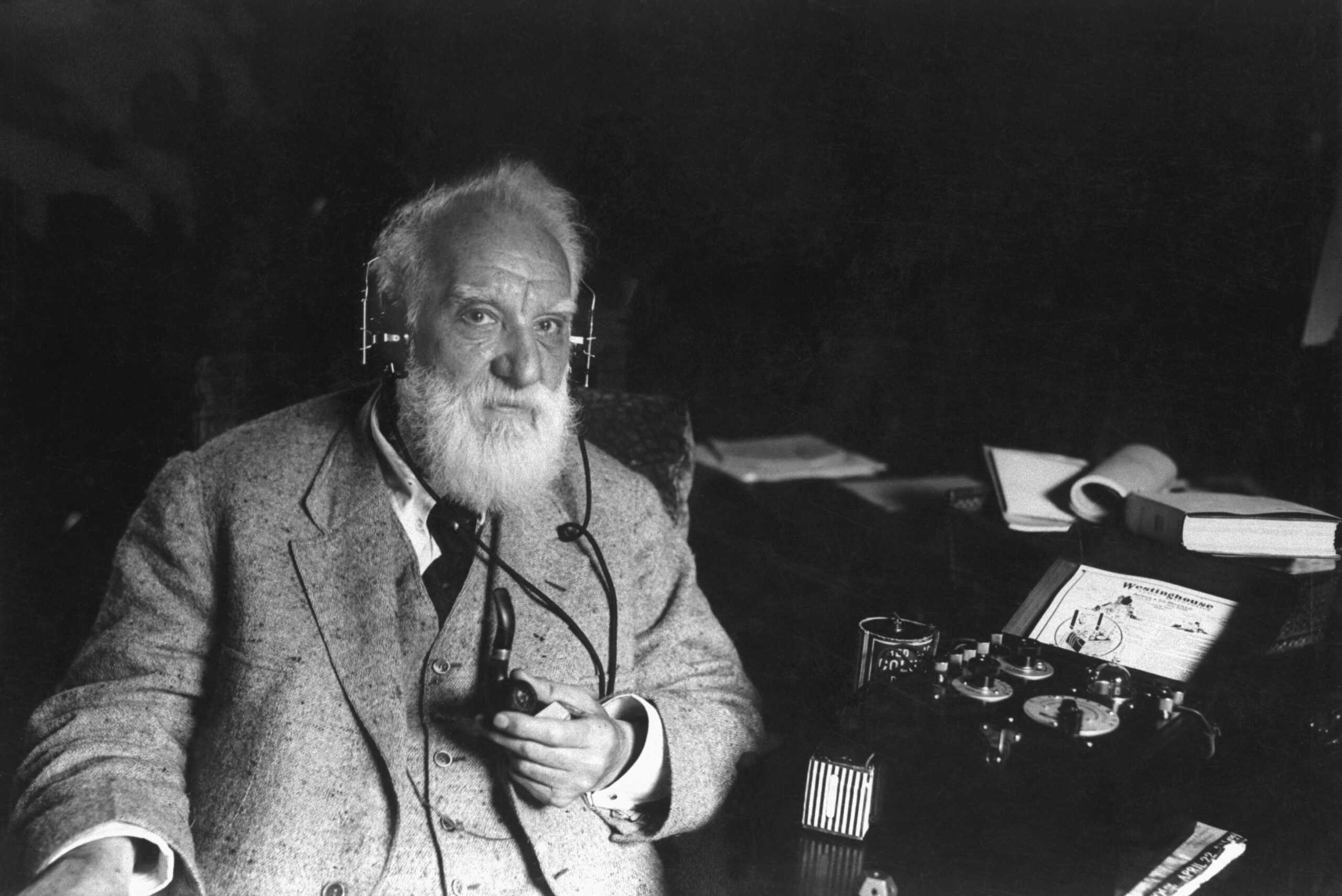 American inventor Alexander Graham Bell (1847-1922) with one of his inventions, ca. 1910. Bell engineered the first intelligible electronic transmission of voice and patented the telephone, and was a founding member and president of the National Geographic Society. (Photo by © CORBIS