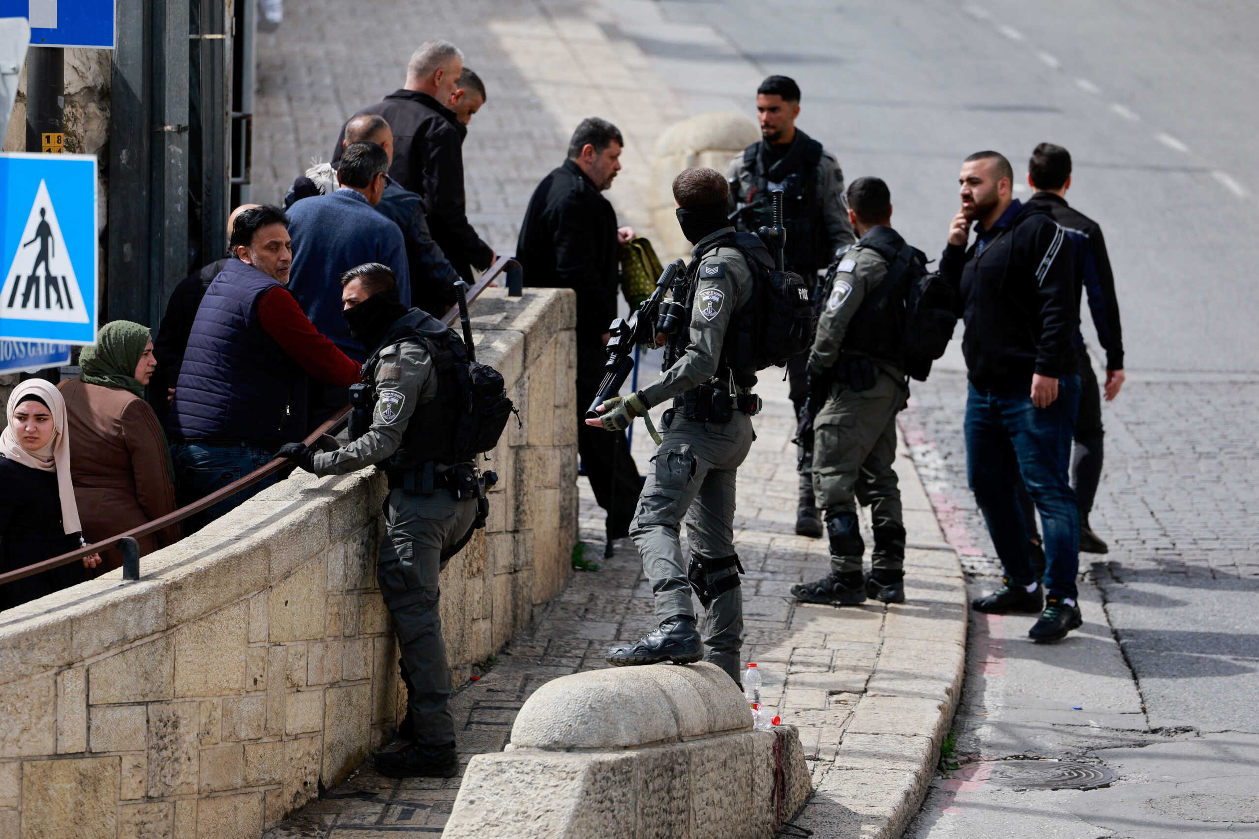 Members of the Israeli Border Police stand as Palestinian Muslims gather to attend Friday prayers, as the conflict between Israel and the Palestinian Islamist group Hamas continues, in Jerusalem, March 1, 2024. REUTERS