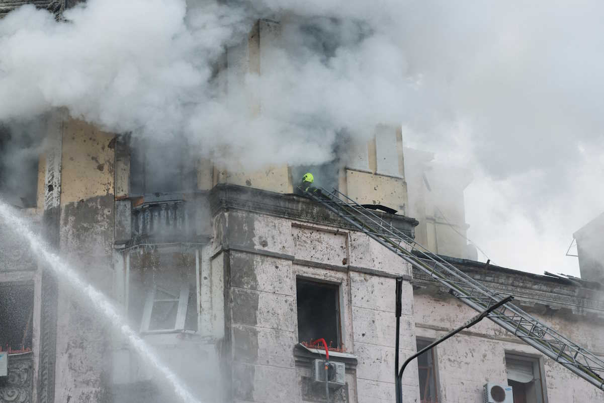 A rescuer works at a site of a building, damaged during a Russian missile strike, amid Russia's attack on Ukraine, in Kyiv, Ukraine March 21, 2024. REUTERS