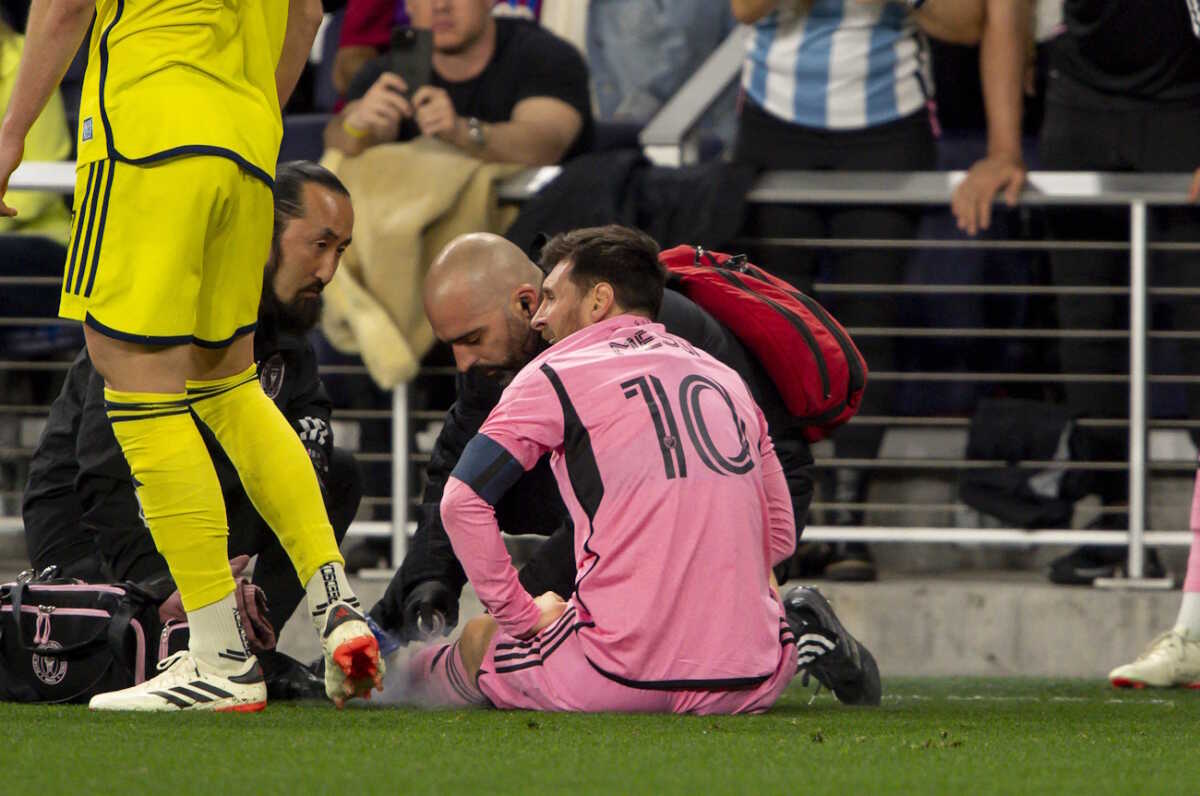 Mar 7, 2024; Nashville, TN, USA;  Inter Miami forward Lionel Messi (10) gets looked at by the trainers against the Nashville SC during the second half at GEODIS Park. Mandatory Credit: Steve Roberts-USA TODAY Sports