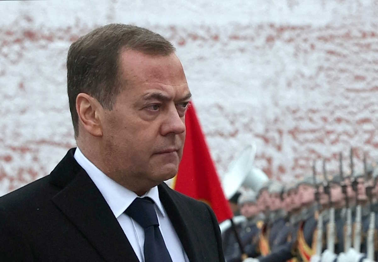 Russia's Deputy head of the Security Council Dmitry Medvedev takes part in a wreath laying ceremony marking Defender of the Fatherland Day at the Tomb of the Unknown Soldier by the Kremlin Wall in Moscow, Russia, February 23, 2024. Sputnik
