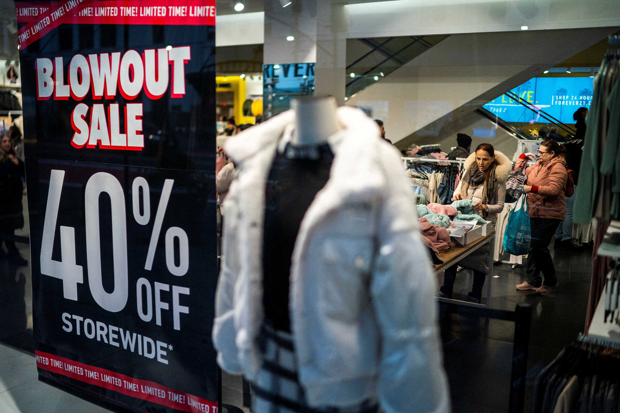 FILE PHOTO: Discounts on offer in a store in New York, U.S., December 25, 2023. REUTERS
