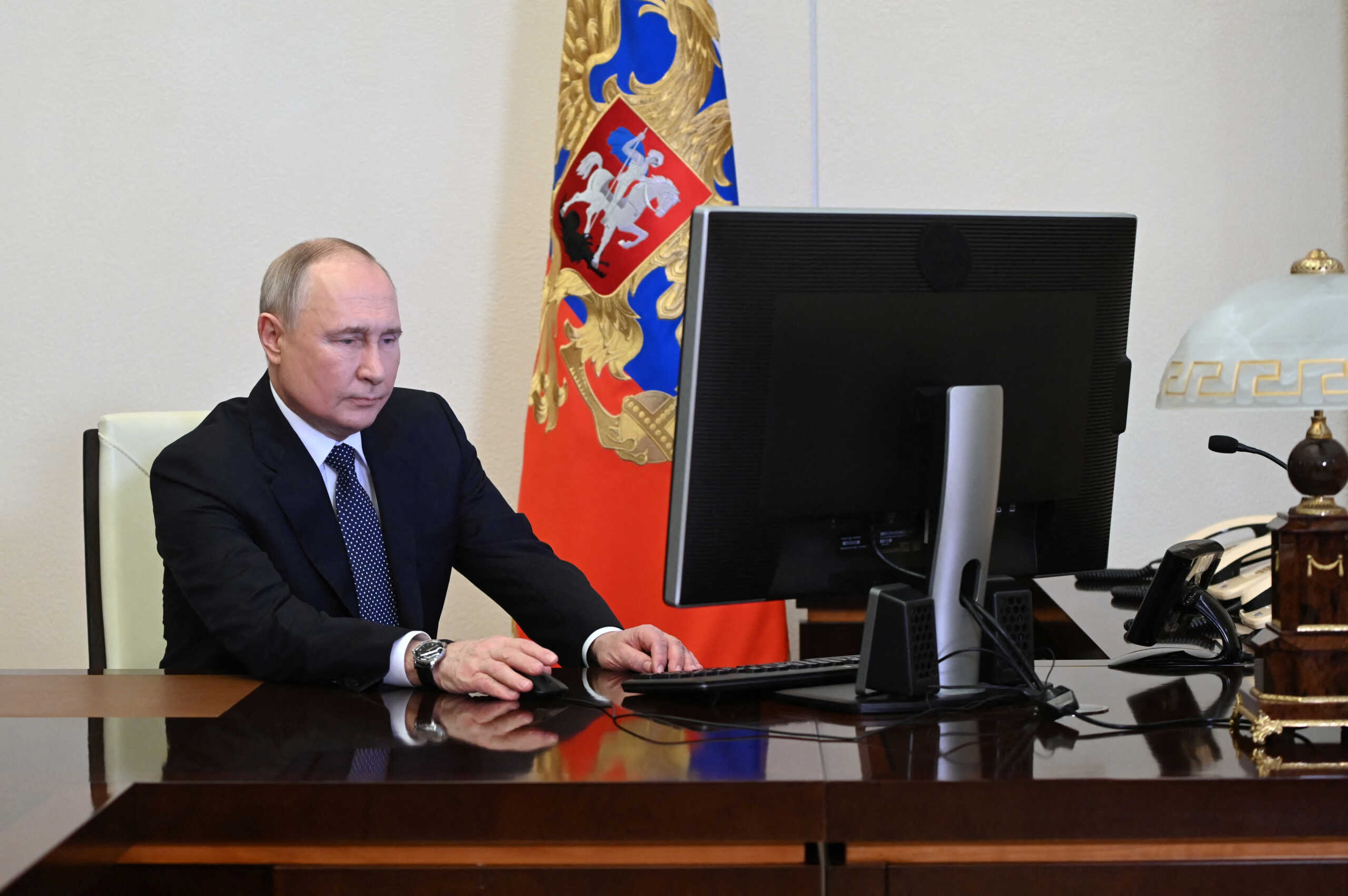 Russian President Vladimir Putin votes online in the presidential election at the Novo-Ogaryovo state residence outside Moscow, Russia March 15, 2024. Sputnik