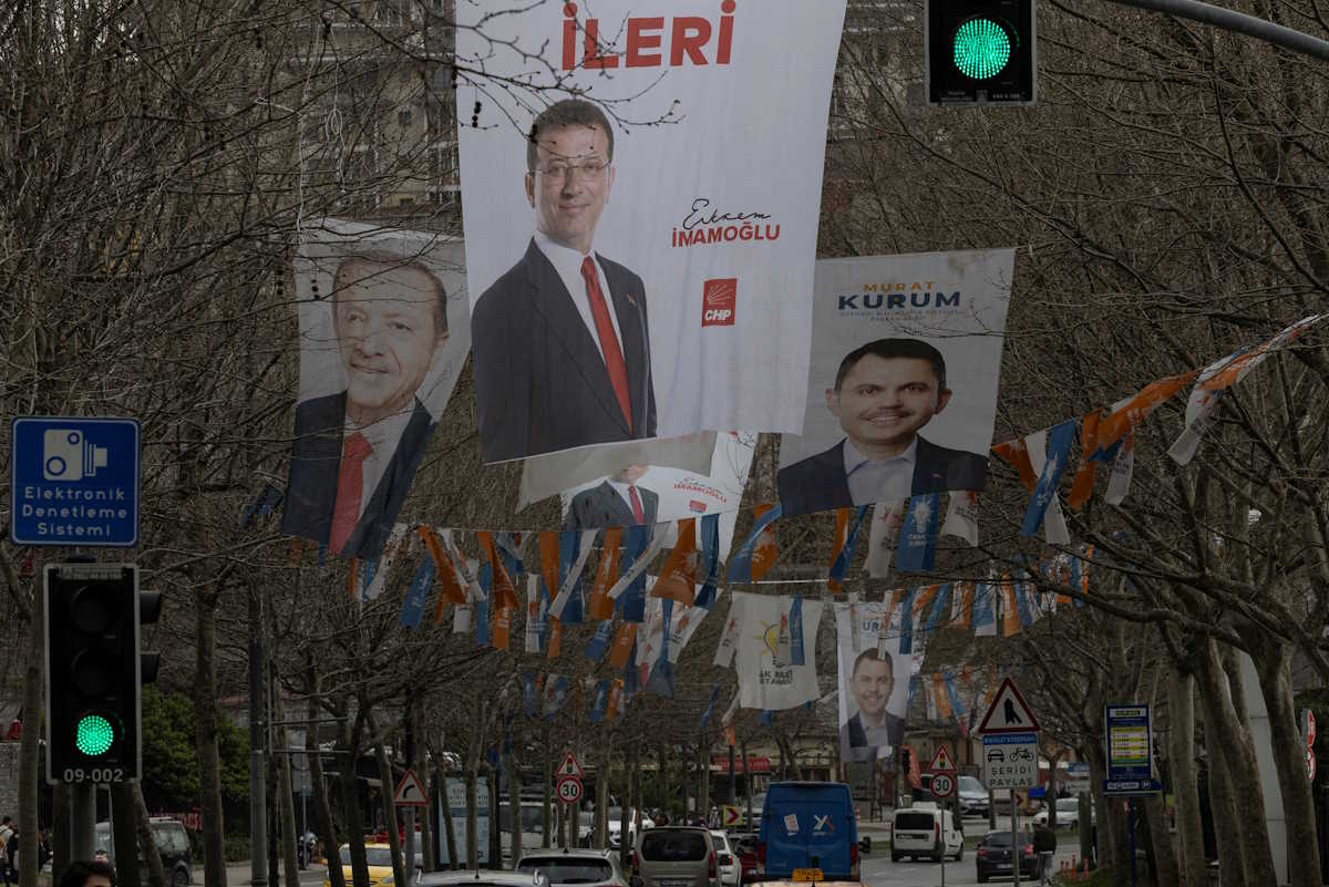 Election banners of Istanbul's mayor Ekrem Imamoglu, President Tayyip Erdogan and Murat Kurum, mayoral candidate of Erdogan's ruling AK Party (AKP) hang along a street ahead of the local elections in Istanbul, Turkey, March 28, 2024. REUTERS