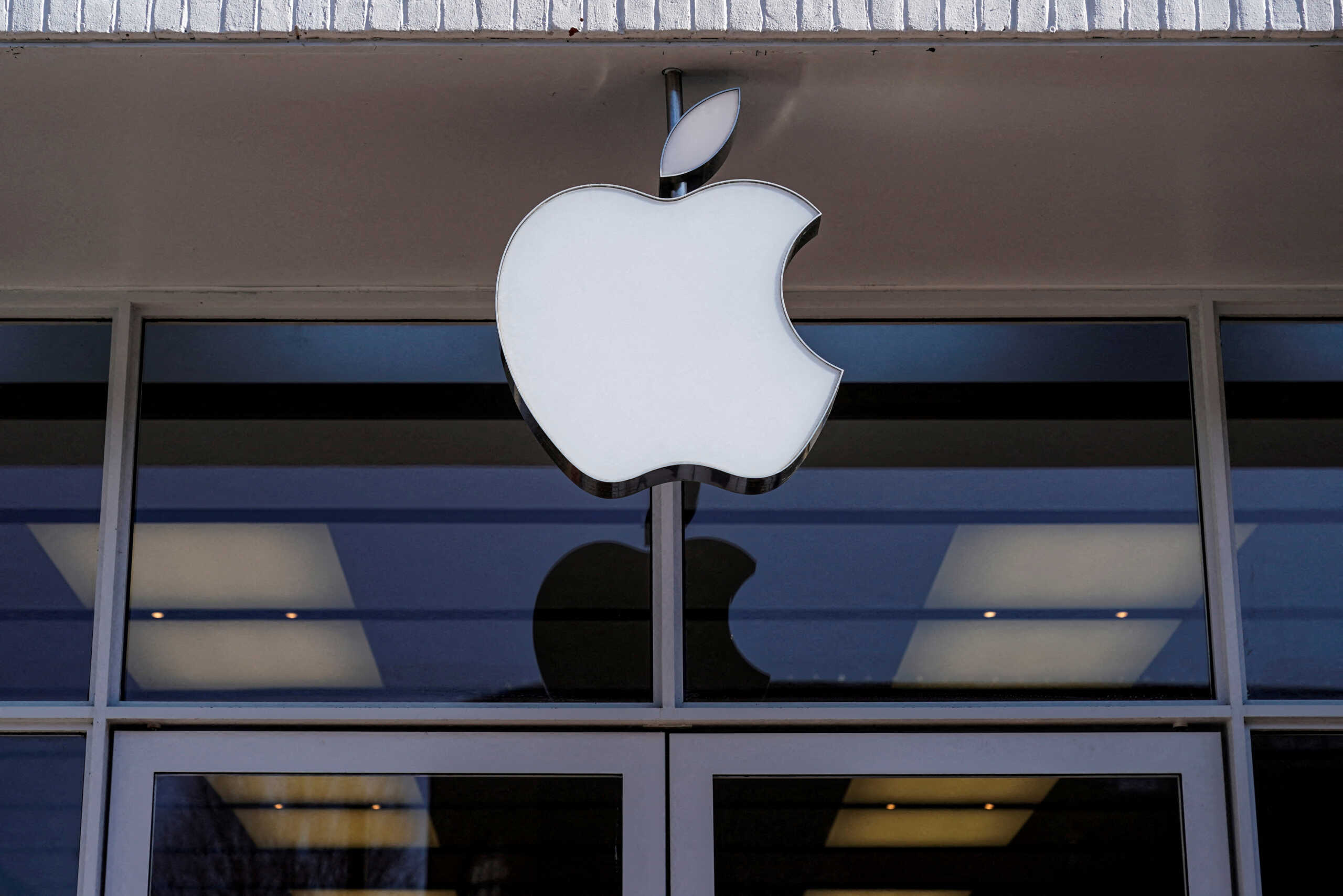 FILE PHOTO: Logo of an Apple store is seen as Apple Inc. reports fourth quarter earnings in Washington, U.S., January 27, 2022.      REUTERS