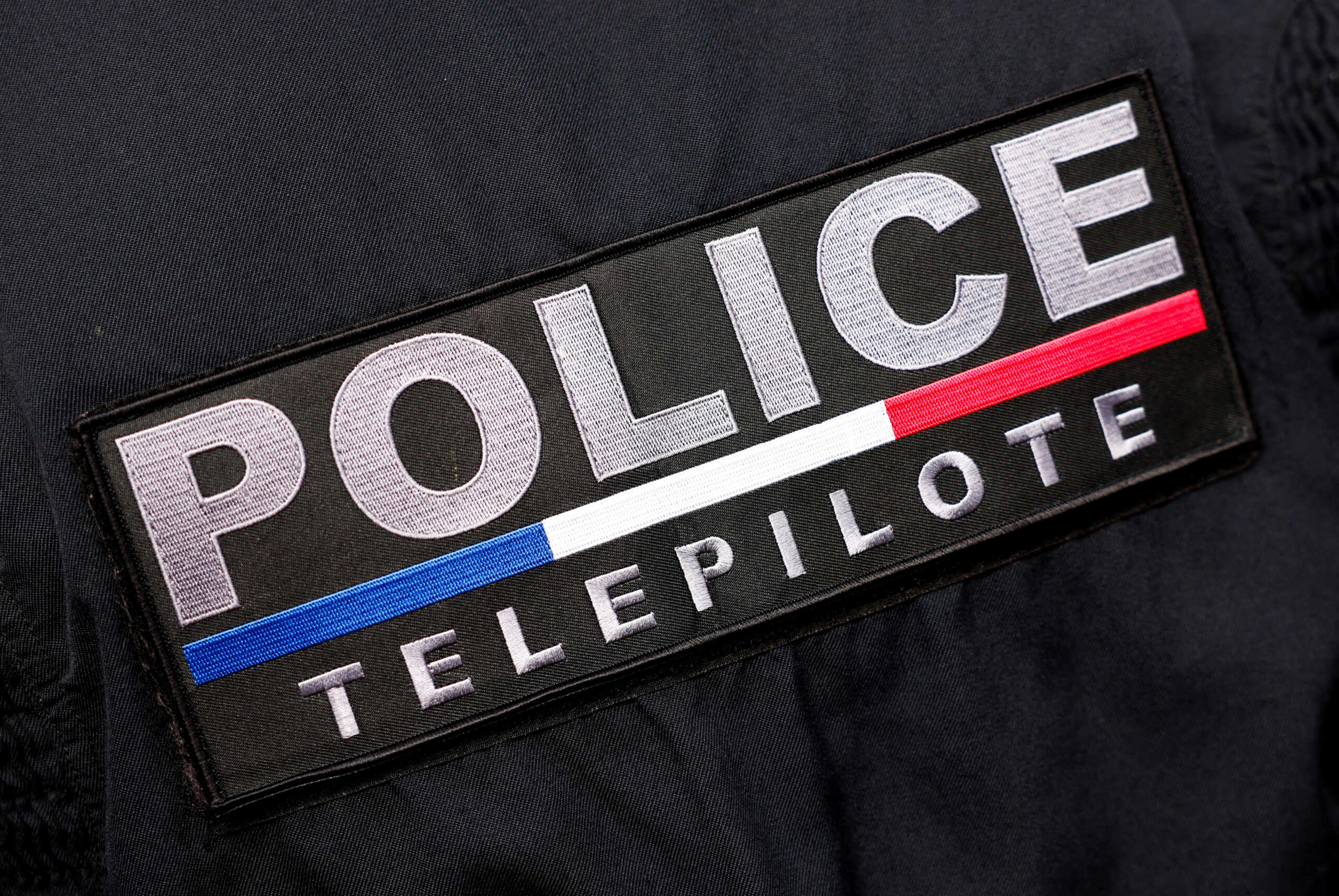 A French police drone pilot badge is seen during a dynamic demonstration of the safety system during the Olympic flame journey ahead of the Paris 2024 Olympic Games, in Beynes near Paris, France, March 18, 2024. REUTERS