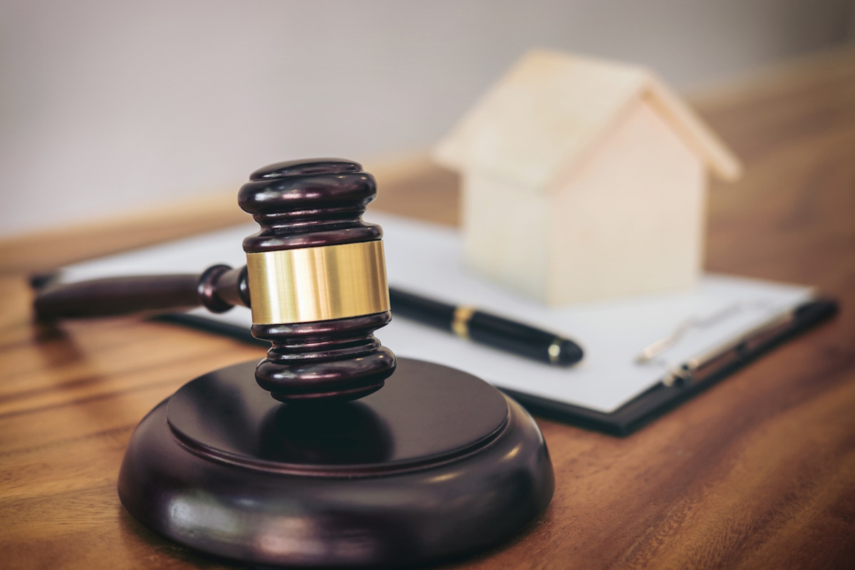 Gavel on sounding block at courtroom for decide home insurance, Law and justice concept, Settle a house dealing lawsuit.