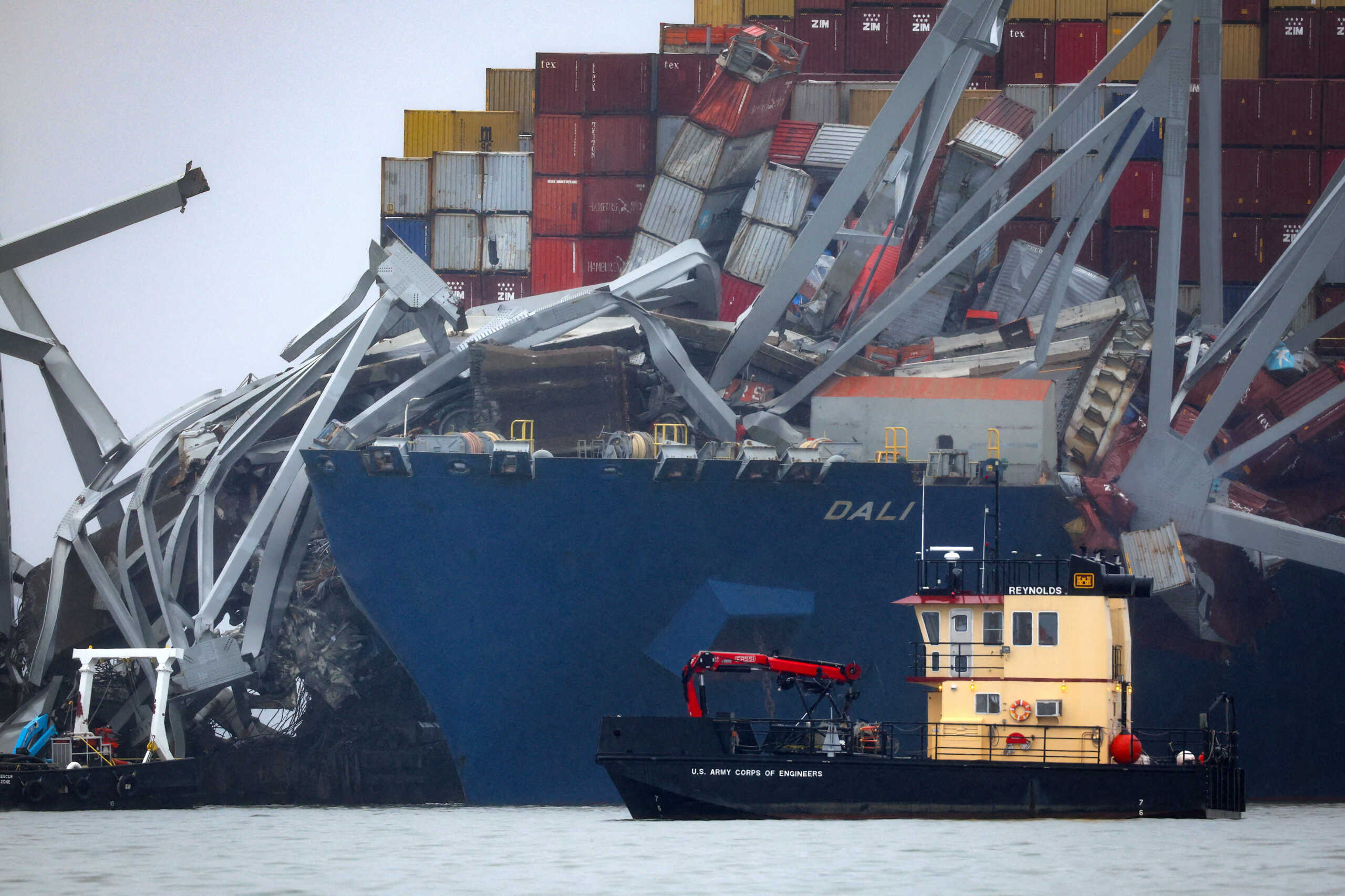 A U.S. Army Corps of Engineers boat passes the wreckage of the Dali cargo vessel, which crashed into the Francis Scott Key Bridge causing it to collapse, in Baltimore, Maryland, U.S., March 27, 2024. REUTERS