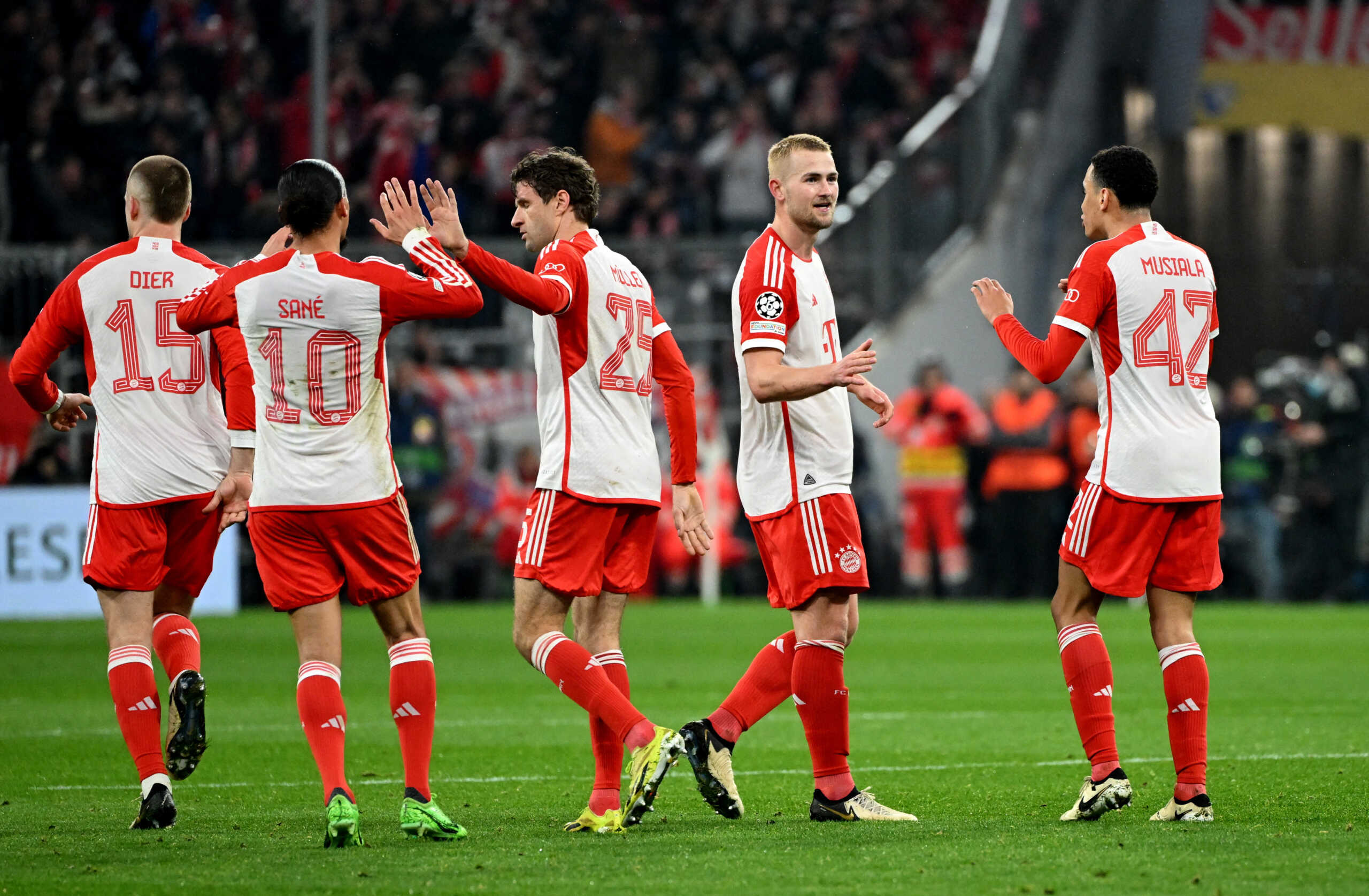 Soccer Football - Champions League - Round of 16 - Second Leg - Bayern Munich v Lazio - Allianz Arena, Munich, Germany - March 5, 2024 Bayern Munich's Thomas Mueller celebrates scoring their second goal with teammates REUTERS