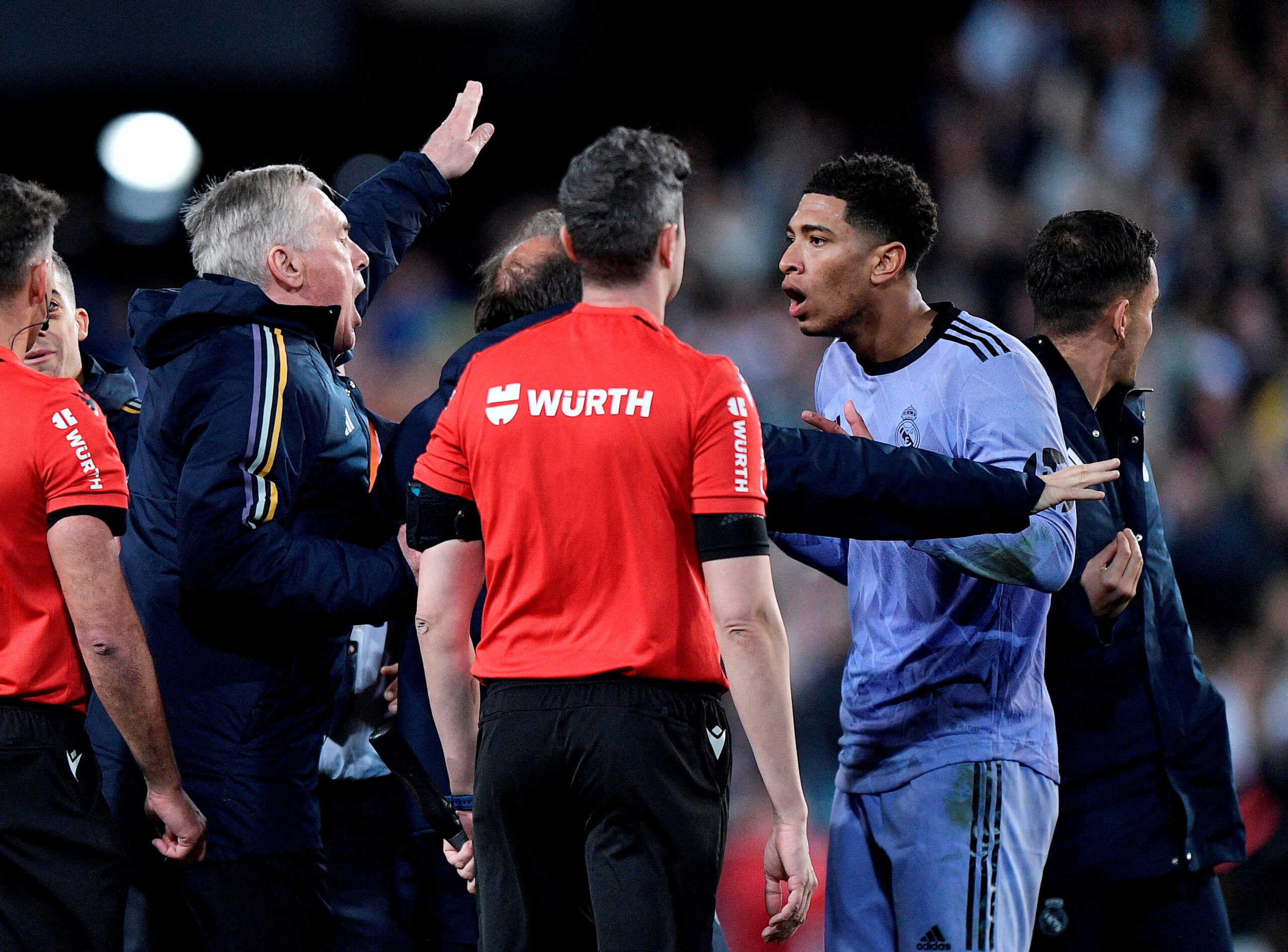 Soccer Football - LaLiga - Valencia v Real Madrid - Mestalla, Valencia, Spain - March 2, 2024 Real Madrid's Jude Bellingham is shown a red card by referee Jesus Gil Manzano after the match as coach Carlo Ancelotti looks on REUTERS