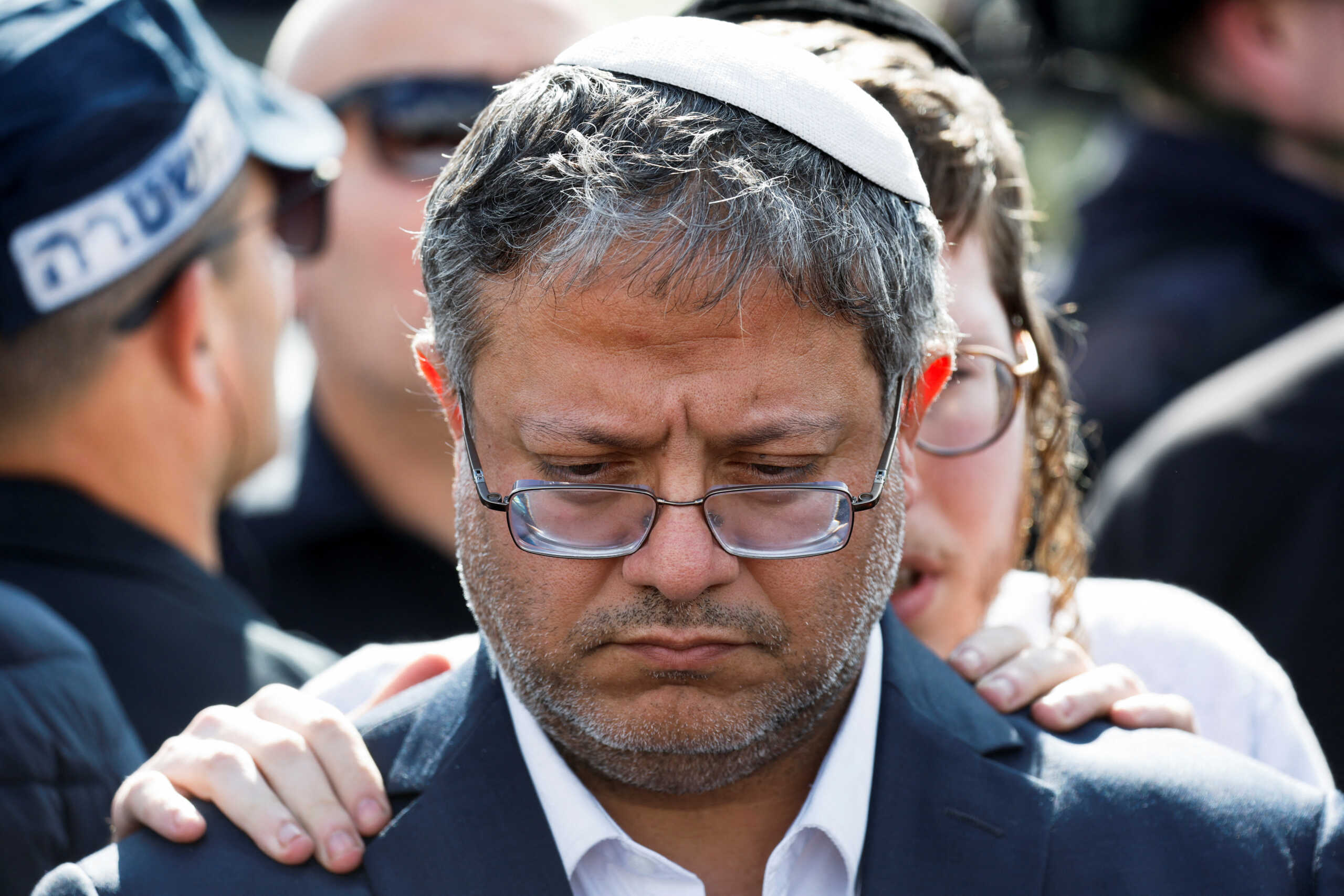 Israel's National Security Minister Itamar Ben-Gvir visits the scene of what Israel's police describe as a suspected shooting attack near Bnei Reem, Israel February 16, 2024. REUTERS