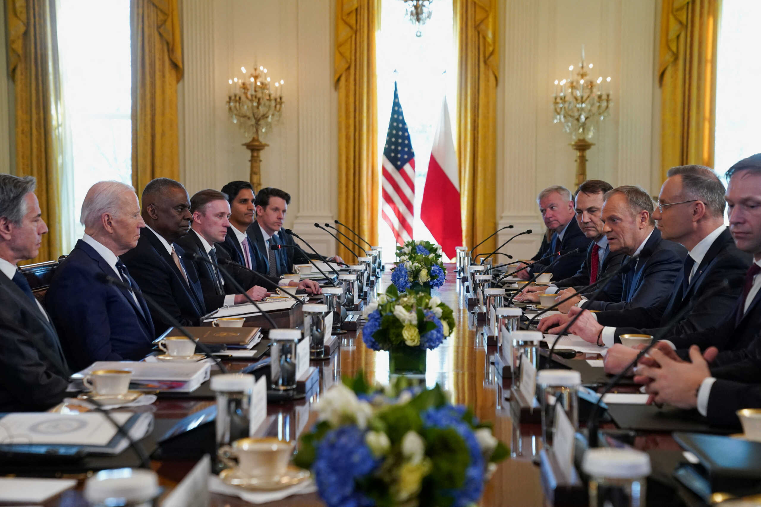 Poland's Prime Minister Donald Tusk speaks next to Poland's President Andrzej Duda during a meeting with U.S. President Joe Biden, at the White House in Washington, U.S., March 12, 2024. REUTERS