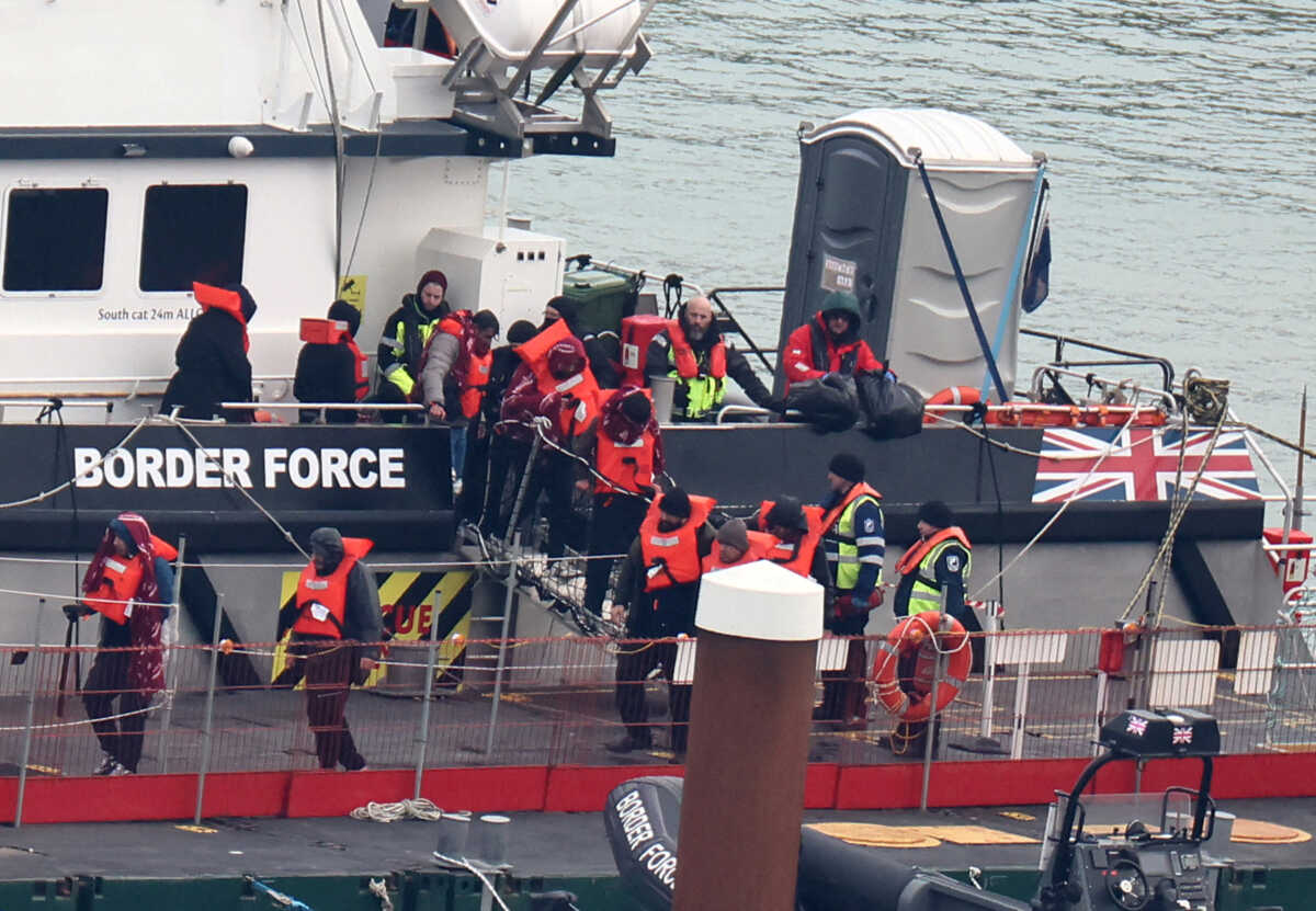 FILE PHOTO: People, believed to be migrants, disembark from a British Border Force vessel as they arrive at Port of Dover, Dover, Britain, January 17, 2024. REUTERS