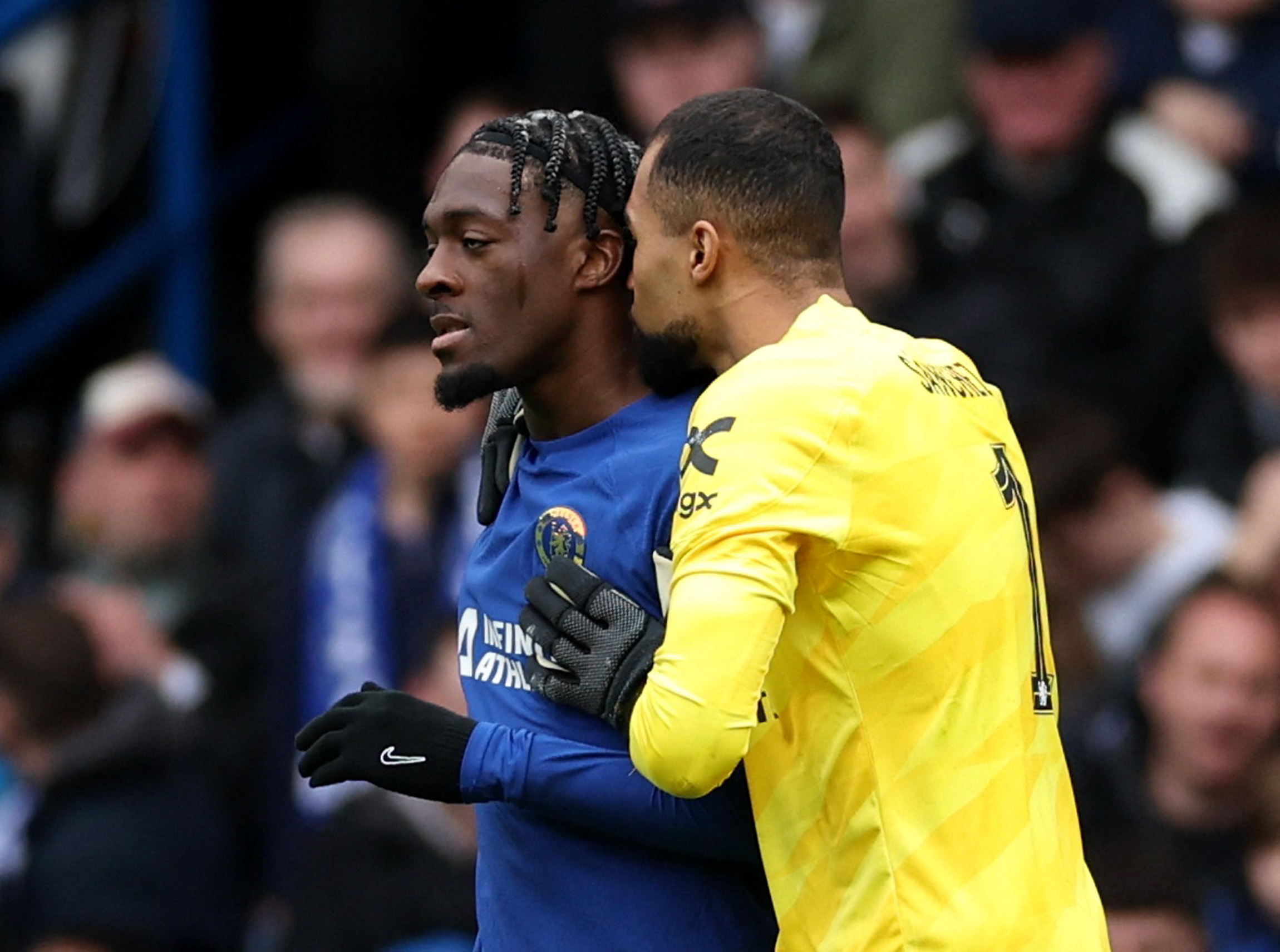 Soccer Football - FA Cup - Quarter Final - Chelsea v Leicester City - Stamford Bridge, London, Britain - March 17, 2024 Chelsea's Robert Sanchez kisses Axel Disasi after he scored an own goal and Leicester City first Action Images via Reuters