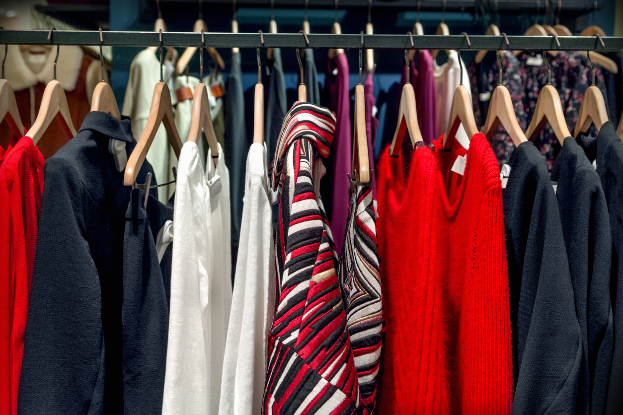 A row of clothes hanging on the rack