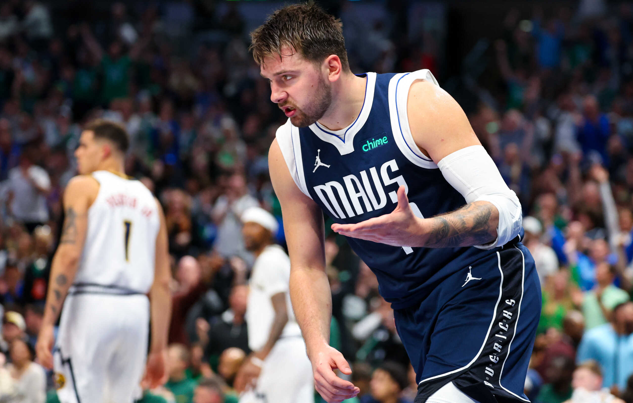 Mar 17, 2024; Dallas, Texas, USA;  Dallas Mavericks guard Luka Doncic (77) reacts after scoring during the second half against the Denver Nuggets at American Airlines Center. Mandatory Credit: Kevin Jairaj-USA TODAY Sports