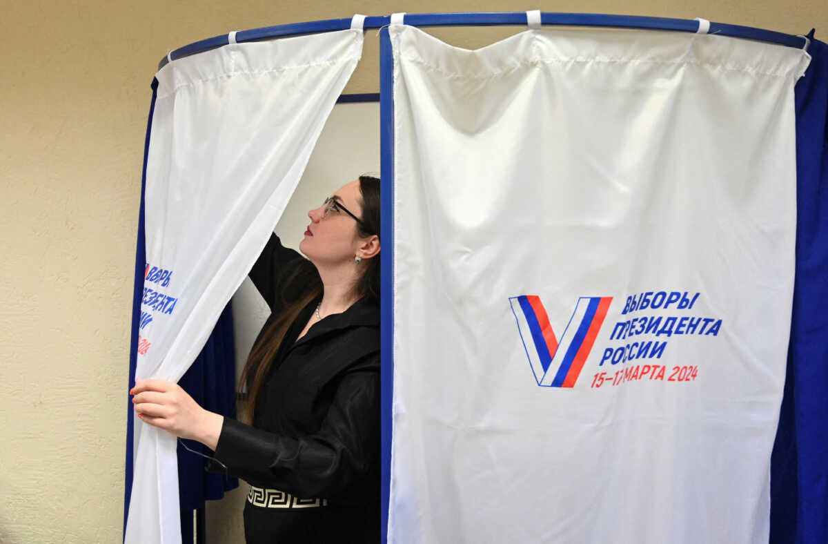 A member of a local electoral commission works at a polling station during preparations for the presidential election, in Rostov-on-Don, Russia, March 14, 2024. REUTERS