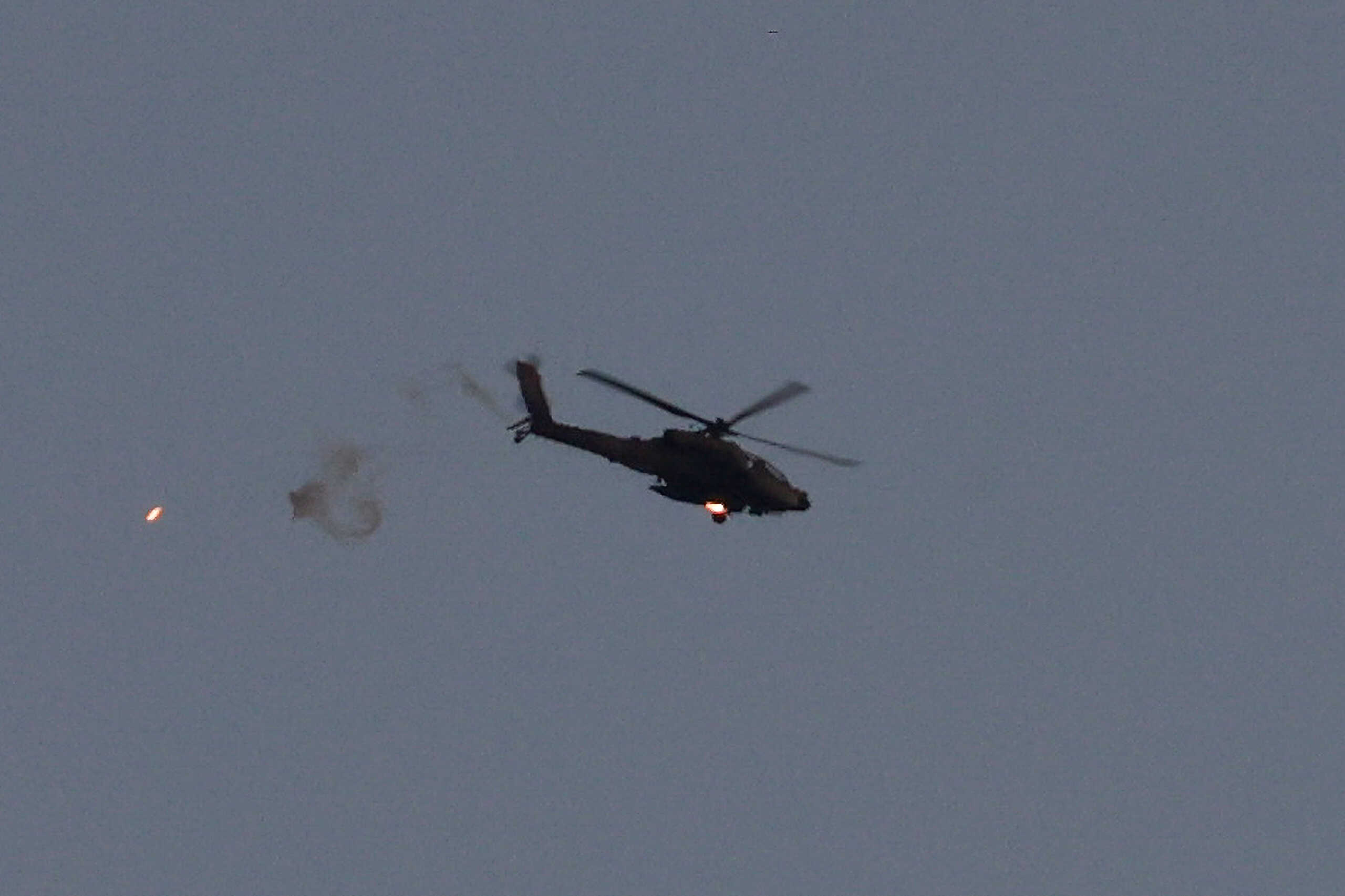 An Israeli Apache attack helicopter releases a flare, amid the ongoing conflict between Israel and the Palestinian Islamist group Hamas, as seen from Israel, March 4, 2024. REUTERS