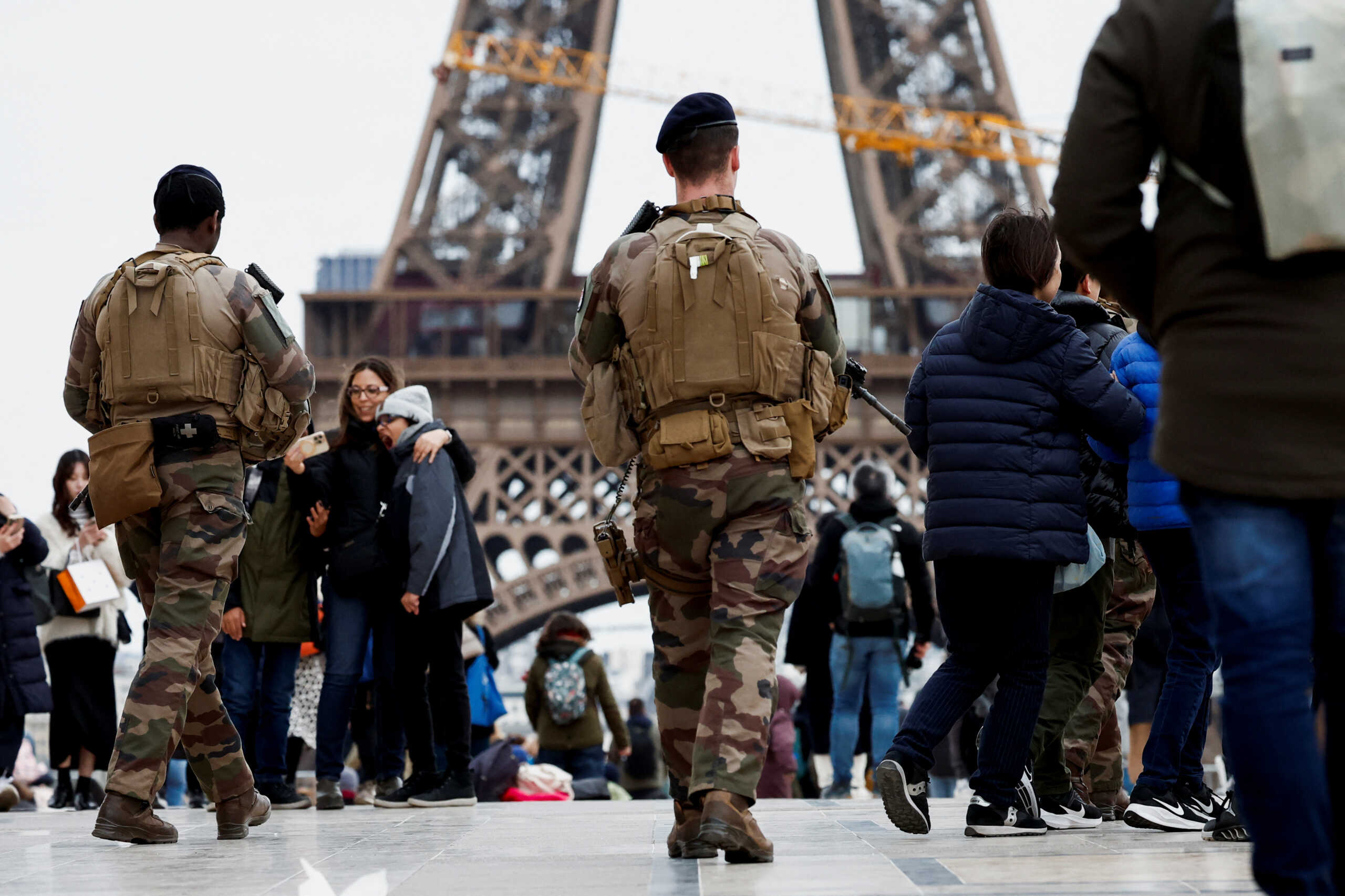 Armed French soldiers patrol on the Trocadero square near the Eiffel Tower as part of the "Vigipirate" security plan as France raises terror alert warning to the highest level, after the Moscow attack, in Paris, France, March 25, 2024. REUTERS