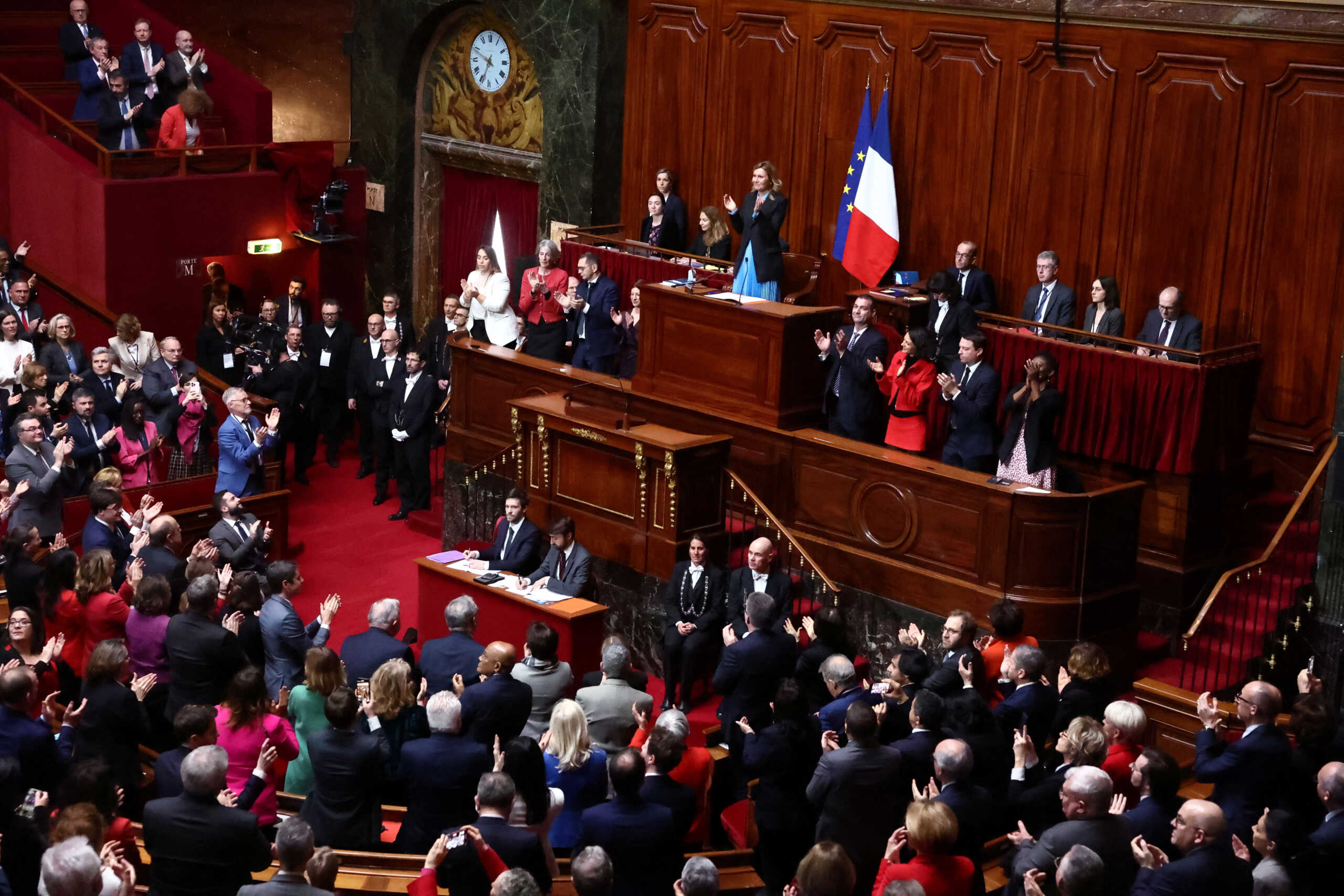 Yael Braun-Pivet, President of the French National Assembly, applauds after French lawmakers enshrined the right to abortion in its constitution, during a special congress gathering both the upper and lower houses of the French parliament (National Assembly and Senate), at the Versailles Palace near Paris, France, March 4, 2024. REUTERS