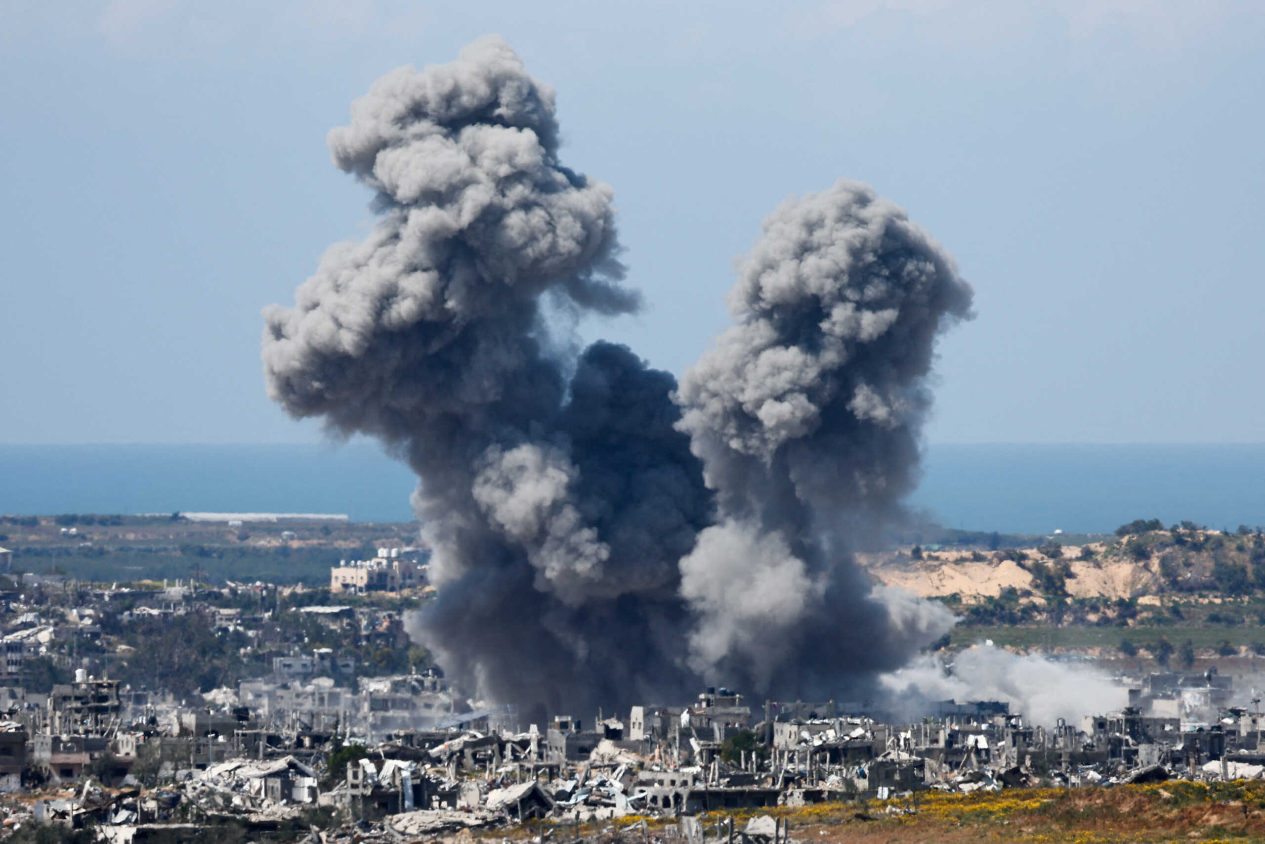 Smoke rises from Gaza during an explosion following an airstrike, amid the ongoing conflict between Israel and Palestinian Islamist group Hamas, as seen from Israel, March 23, 2024. REUTERS