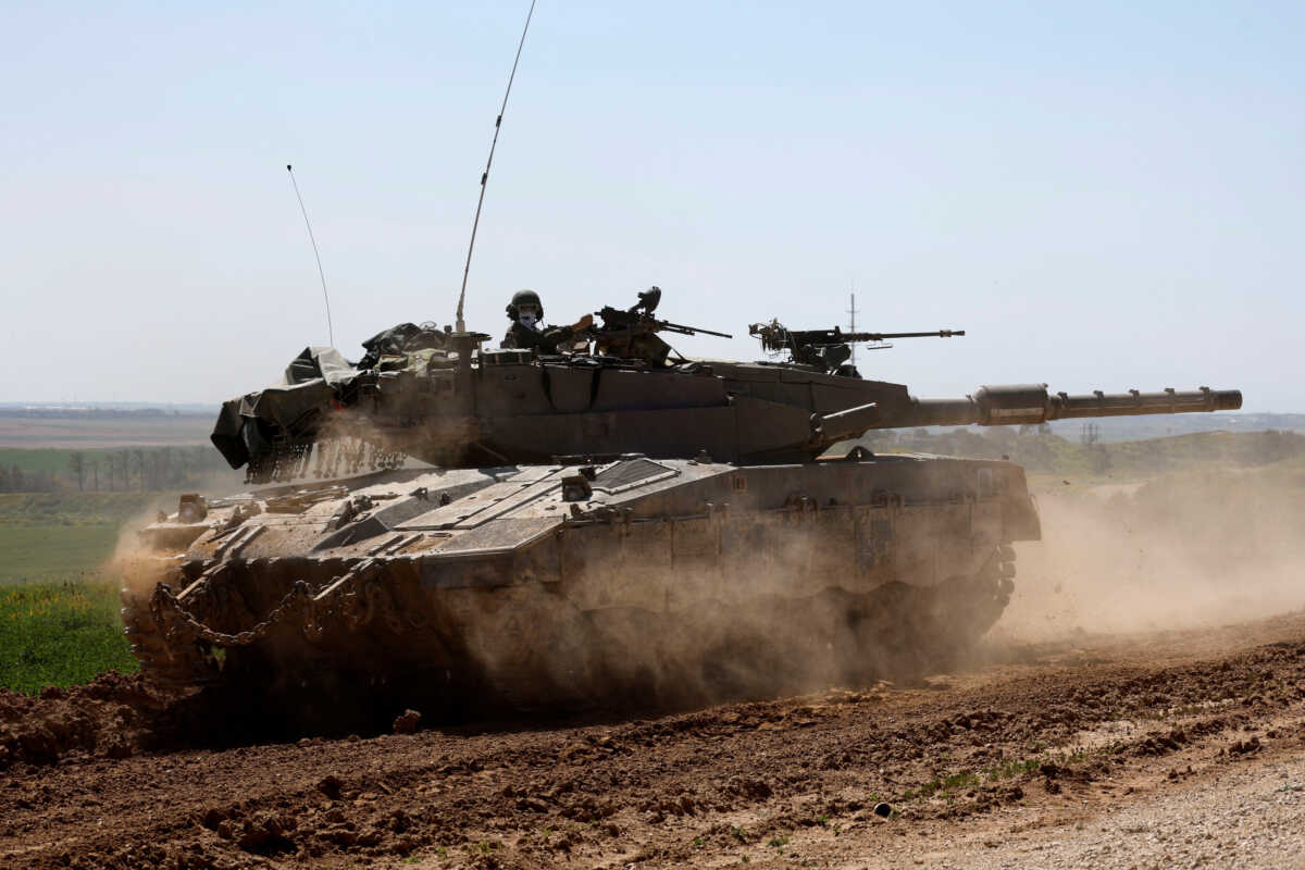 An Israeli tank maneuvers near Israel's border with Gaza, amid the ongoing conflict between Israel and the Palestinian Islamist group Hamas, in southern Israel, March 20, 2024. REUTERS