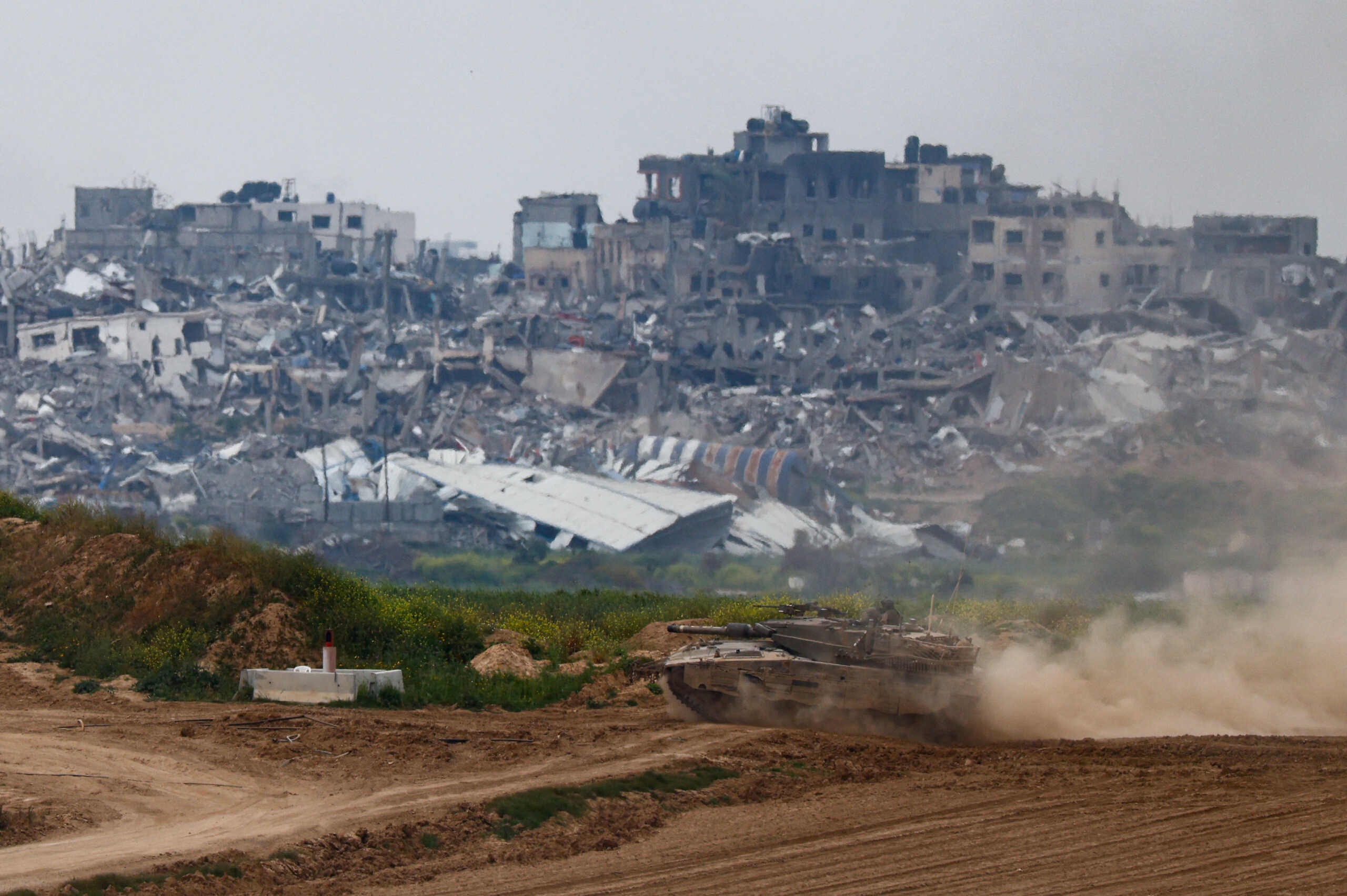 A tank maneuvers at the Israel-Gaza border, amid the ongoing conflict between Israel and the Palestinian Islamist group Hamas, in Israel, March 17, 2024. REUTERS