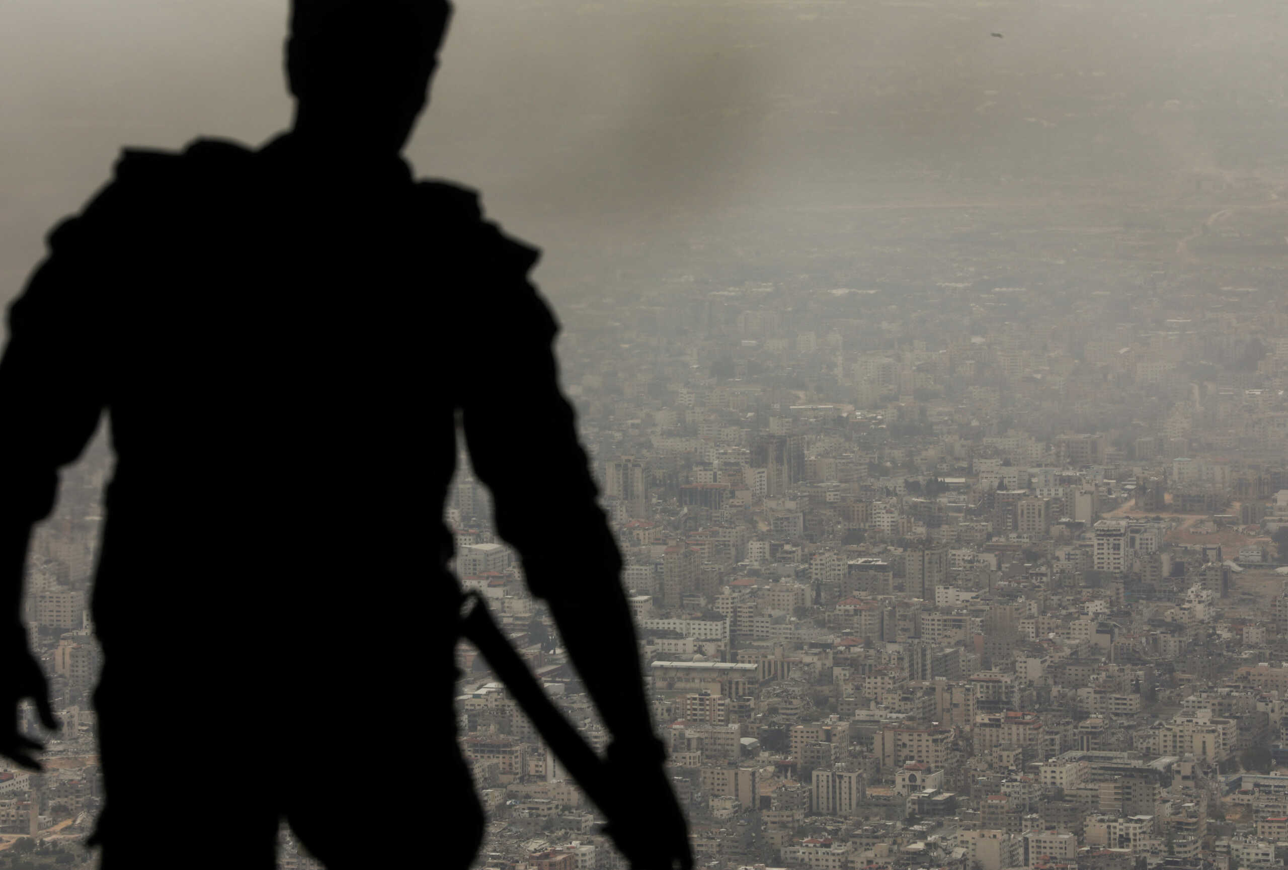 A member of Jordanian armed forces air drops aid parcels over Gaza, March 29, 2024. REUTERS