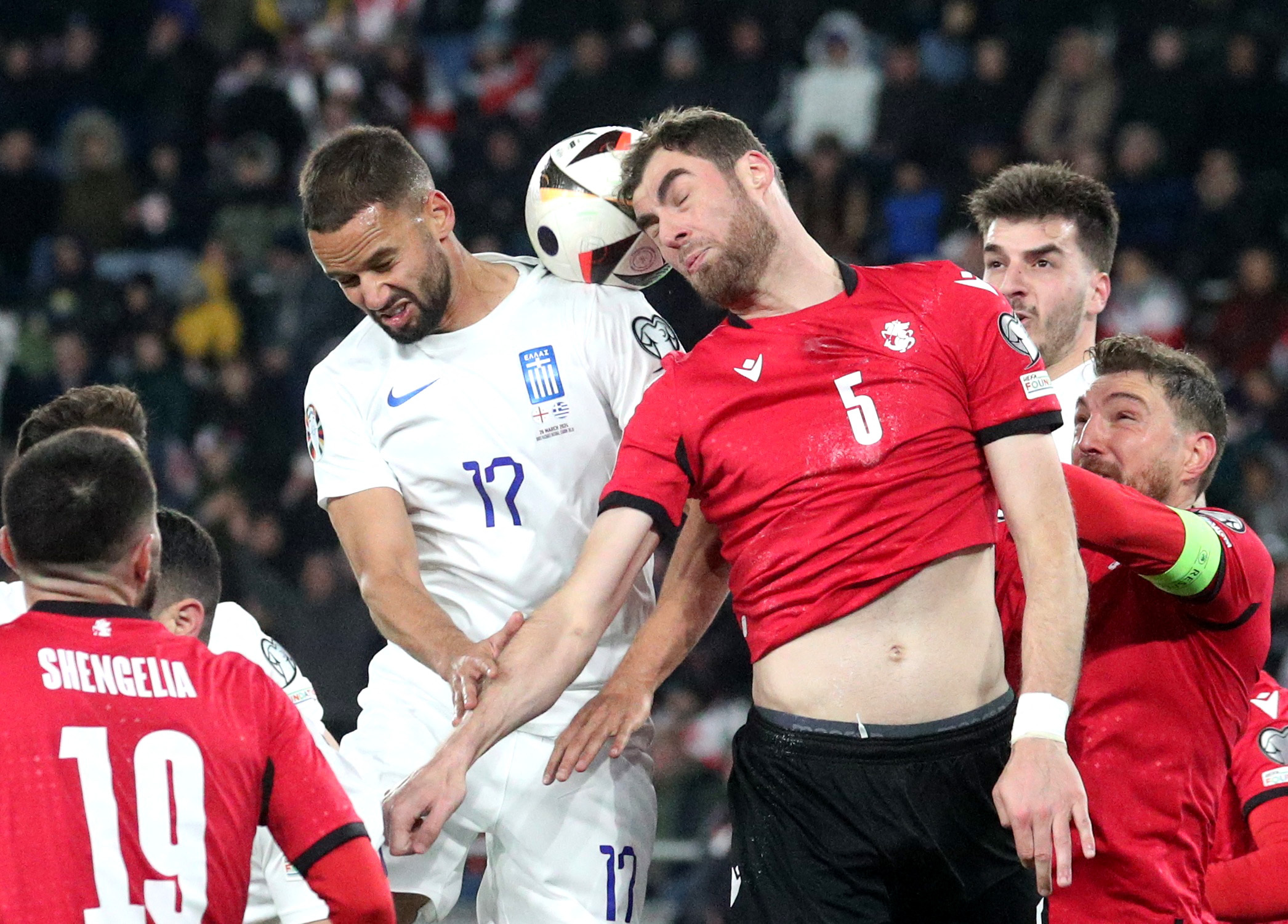 Soccer Football - Euro 2024 Qualifier - Play off - Georgia v Greece - Boris Paichadze Dinamo Arena, Tbilisi, Georgia - March 26, 2024 Greece's Pantelis Hatzidiakos in action with Georgia's Solomon Kvirkvelia REUTERS