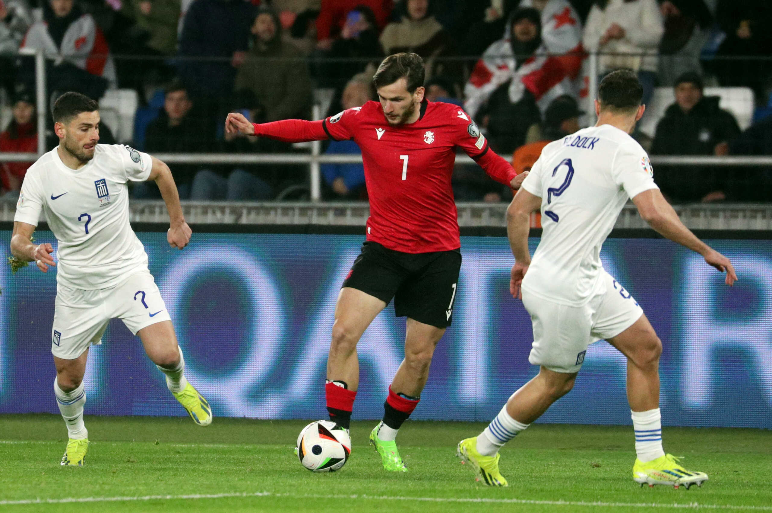 Soccer Football - Euro 2024 Qualifier - Play off - Georgia v Greece - Boris Paichadze Dinamo Arena, Tbilisi, Georgia - March 26, 2024 Georgia's Khvicha Kvaratskhelia in action with Greece's George Baldock and Greece's George Baldock REUTERS