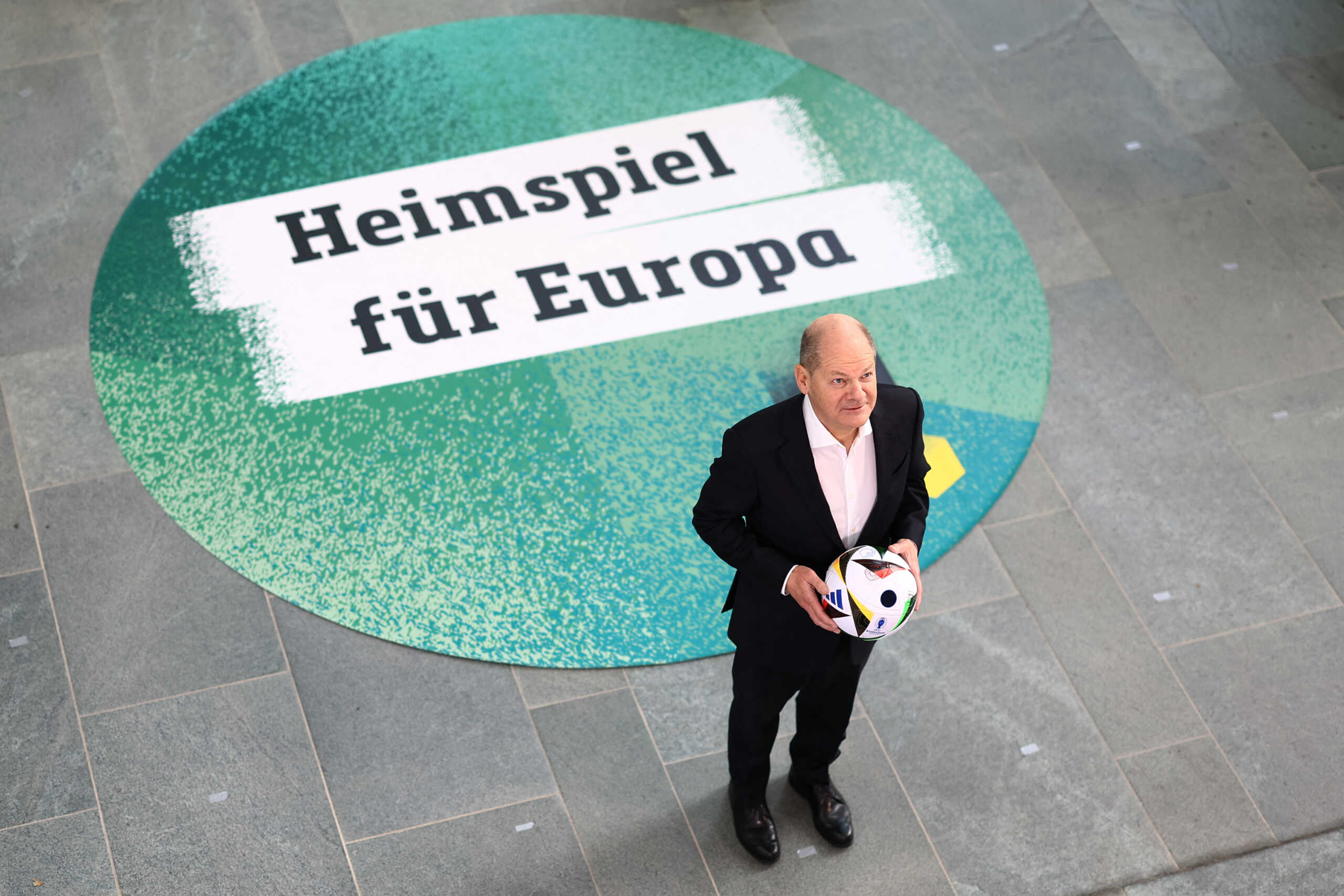 German Chancellor Olaf Scholz attends a photo call to mark the 100-day countdown to the opening game of UEFA Euro 2024 in Berlin, Germany, March 6, 2024 REUTERS
