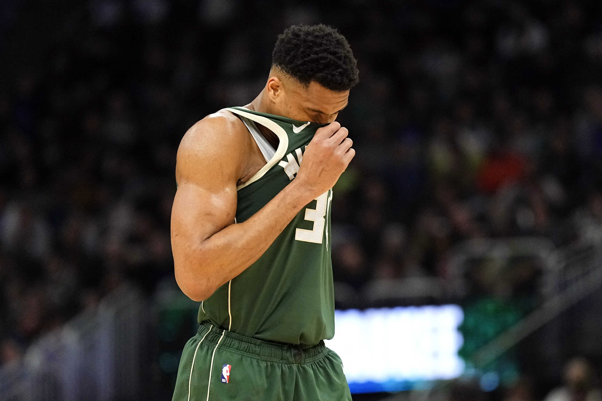 Mar 24, 2024; Milwaukee, Wisconsin, USA;  Milwaukee Bucks forward Giannis Antetokounmpo (34) wipes his face during the first quarter against the Oklahoma City Thunder at Fiserv Forum. Mandatory Credit: Jeff Hanisch-USA TODAY Sports