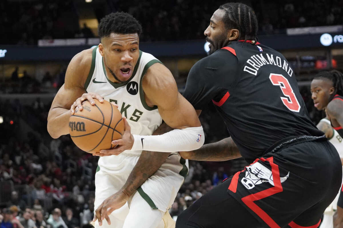 Mar 1, 2024; Chicago, Illinois, USA; Chicago Bulls center Andre Drummond (3) defends Milwaukee Bucks forward Giannis Antetokounmpo (34) during the second half at United Center. Mandatory Credit: David Banks-USA TODAY Sports