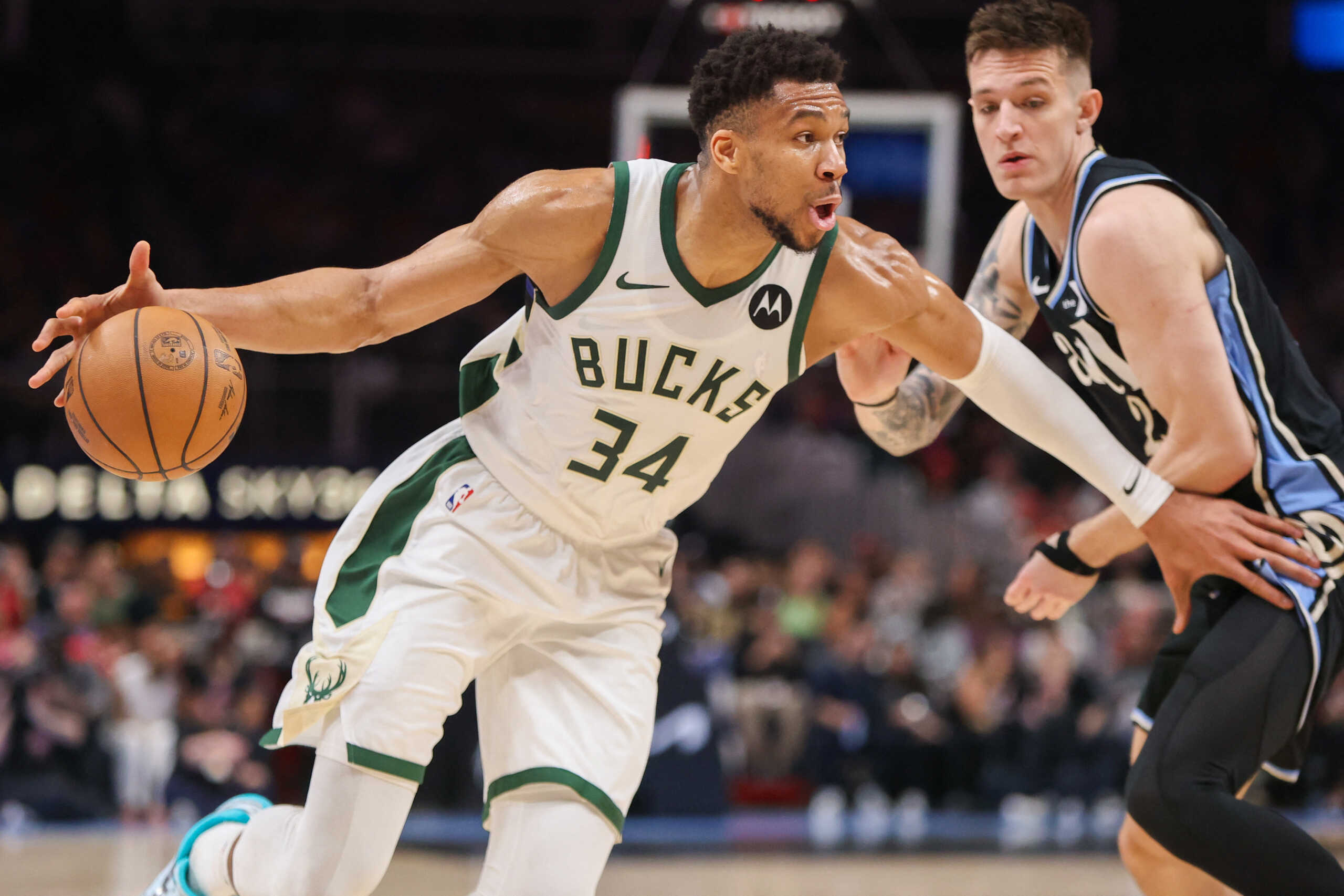 Mar 30, 2024; Atlanta, Georgia, USA; Milwaukee Bucks forward Giannis Antetokounmpo (34) drives on Atlanta Hawks guard Vit Krejci (27) in the second quarter at State Farm Arena. Mandatory Credit: Brett Davis-USA TODAY Sports