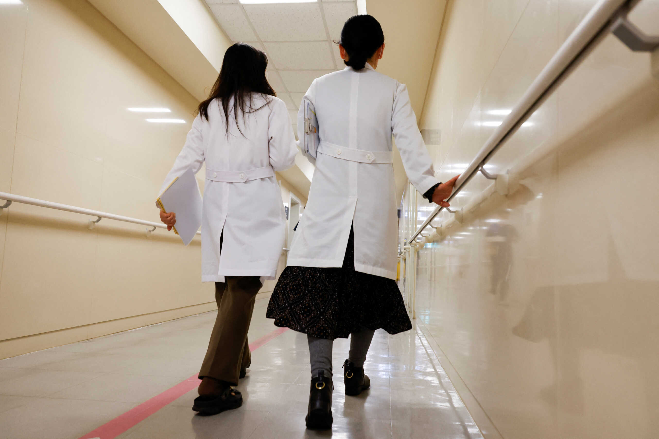 Medical workers walk at Severance Hospital in Seoul, South Korea, February 21, 2024. REUTERS