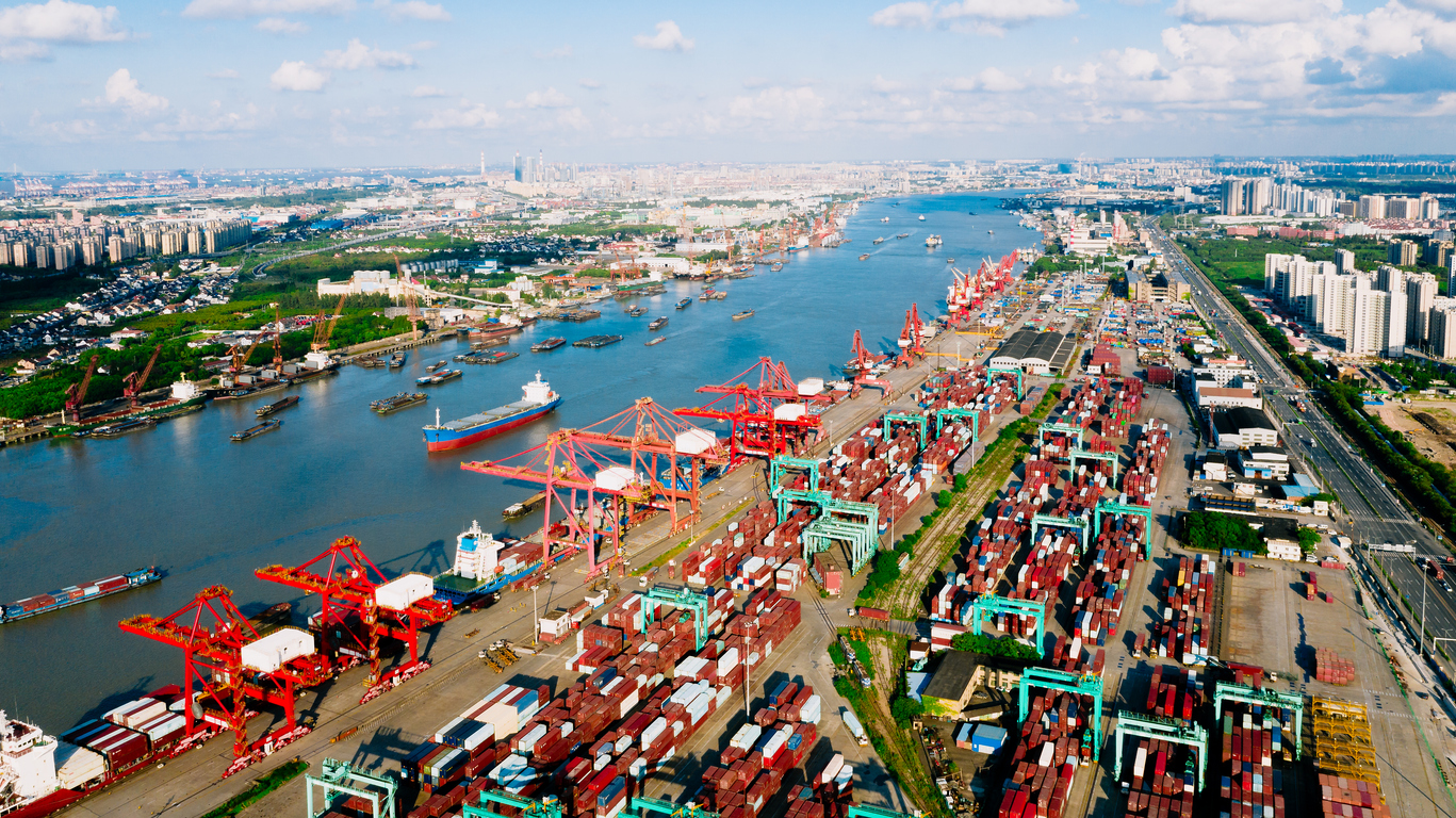 Aerial view container ship loading and unloading.