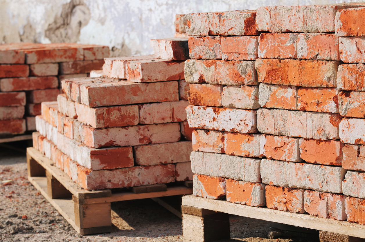 Used bricks placed on pallets.