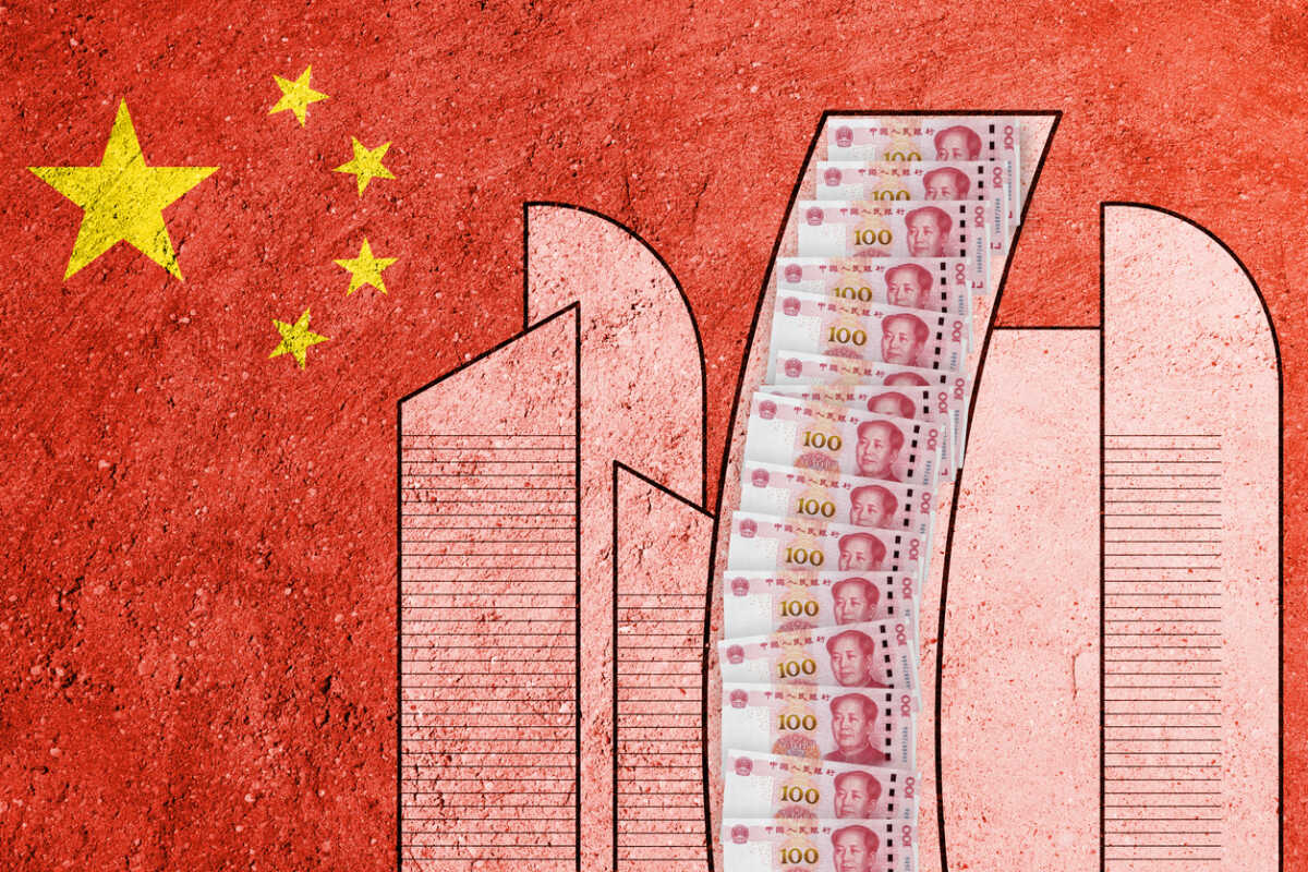 Flag of China painted on a concrete wall. Chinese real estate and debt crisis. Economic crisis
