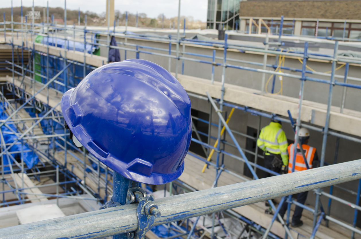 blue safety hat on building site