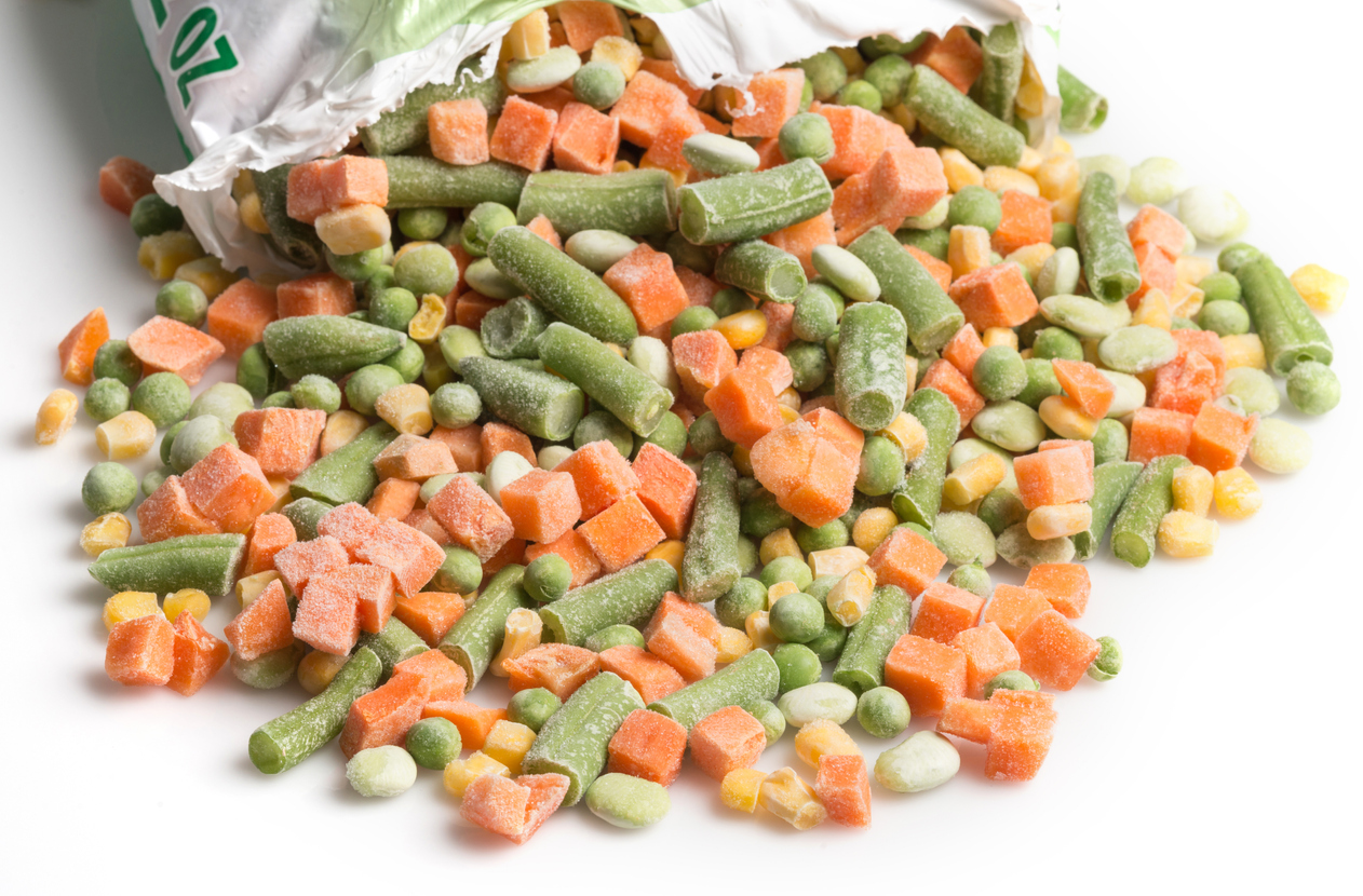 Closeup view of an open bag of frozen vegetables assortment