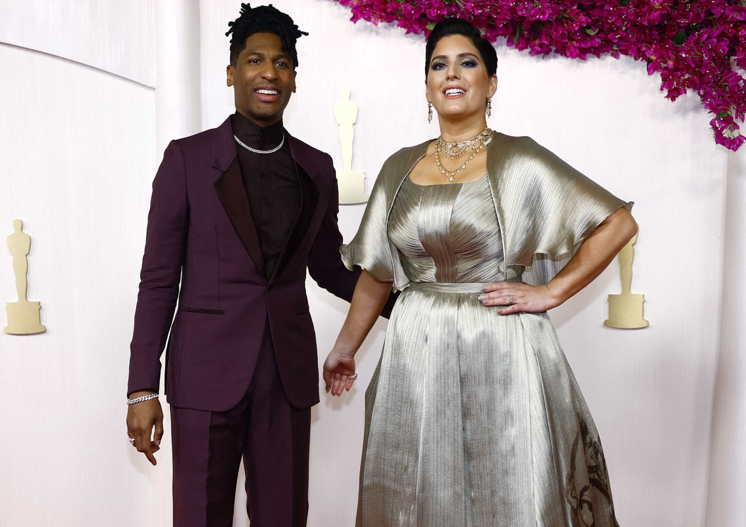 Jon Batiste and Suleika Jaouad pose on the red carpet during the Oscars arrivals at the 96th Academy Awards in Hollywood, Los Angeles, California, U.S., March 10, 2024. REUTERS
