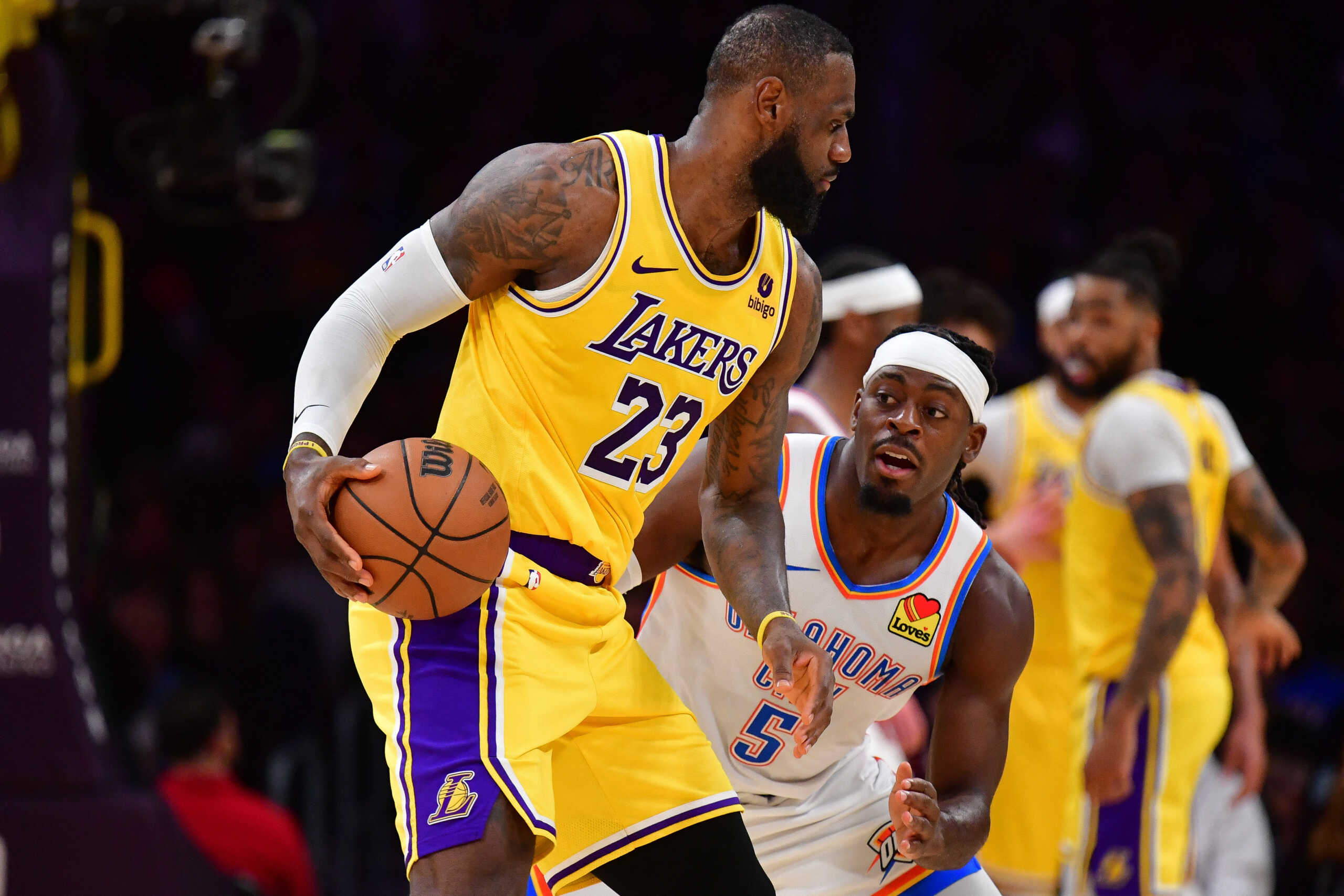 Mar 4, 2024; Los Angeles, California, USA; Los Angeles Lakers forward LeBron James (23) moves the ball against Oklahoma City Thunder guard Luguentz Dort (5) during the second half at Crypto.com Arena. Mandatory Credit: Gary A. Vasquez-USA TODAY Sports