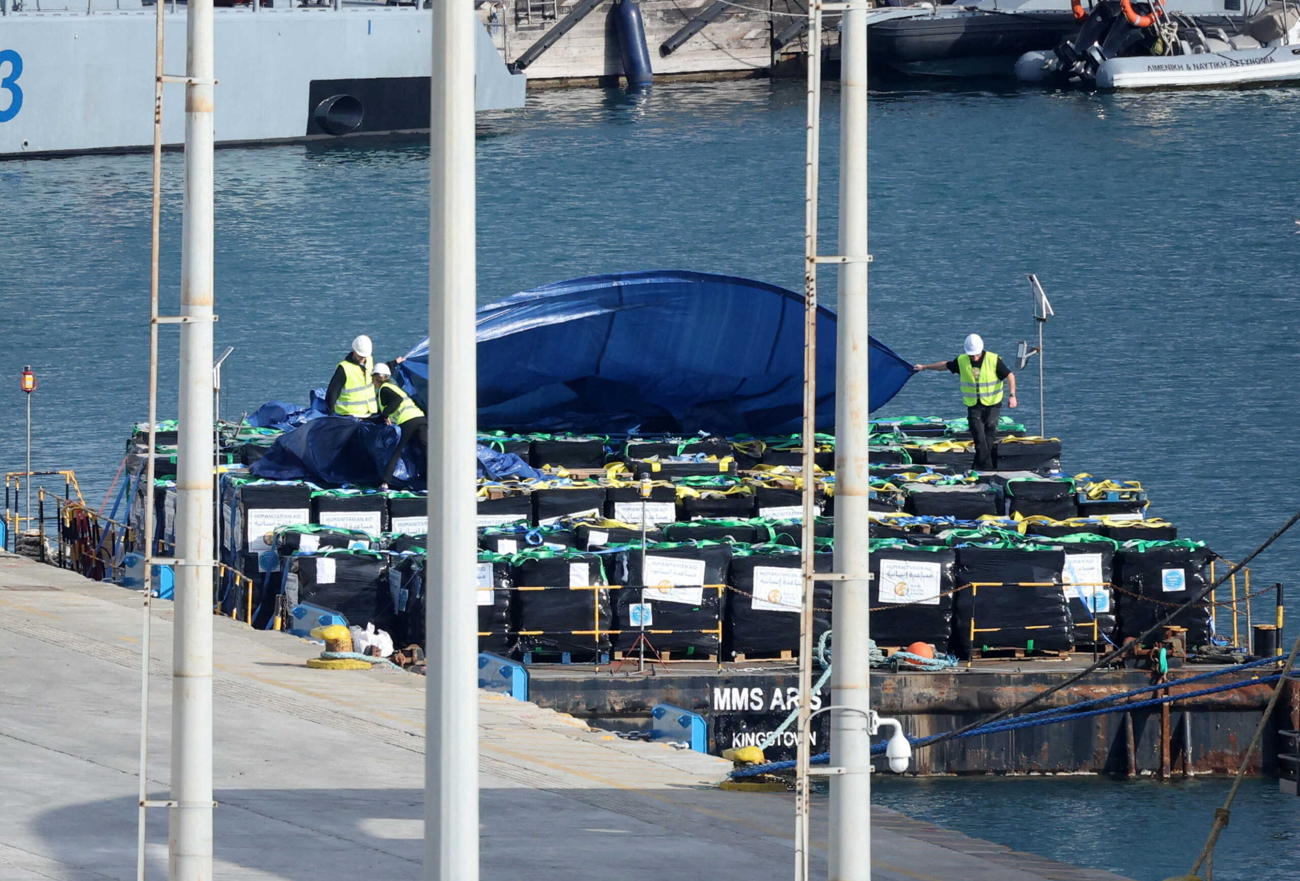 Humanitarian aid for Gaza is loaded on a platform next to the Spanish NGO Open Arms rescue vessel, as the conflict between Israel and the Palestinian Islamic group Hamas continues, at the port of Larnaca, Cyprus March 9, 2024. REUTERS