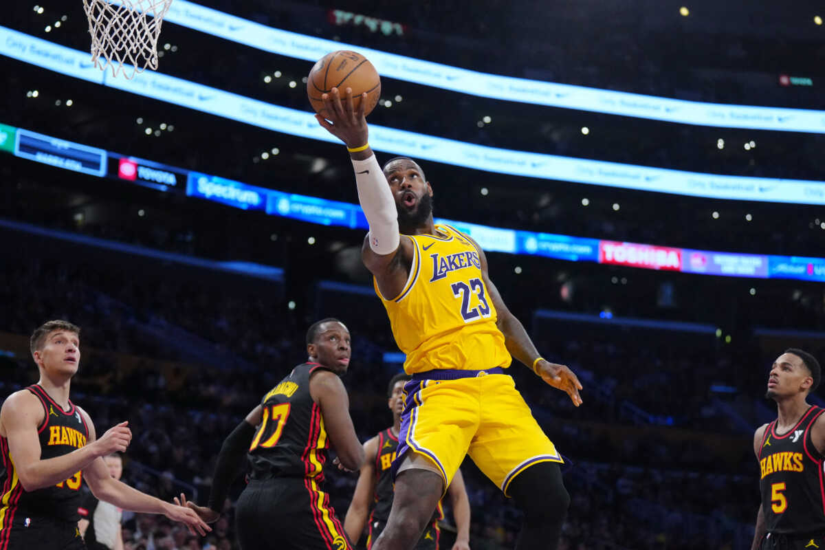 Mar 18, 2024; Los Angeles, California, USA; Los Angeles Lakers forward LeBron James (23) shoots the ball against Atlanta Hawks forward Onyeka Okongwu (17) in the second half at Crypto.com Arena. Mandatory Credit: Kirby Lee-USA TODAY Sports