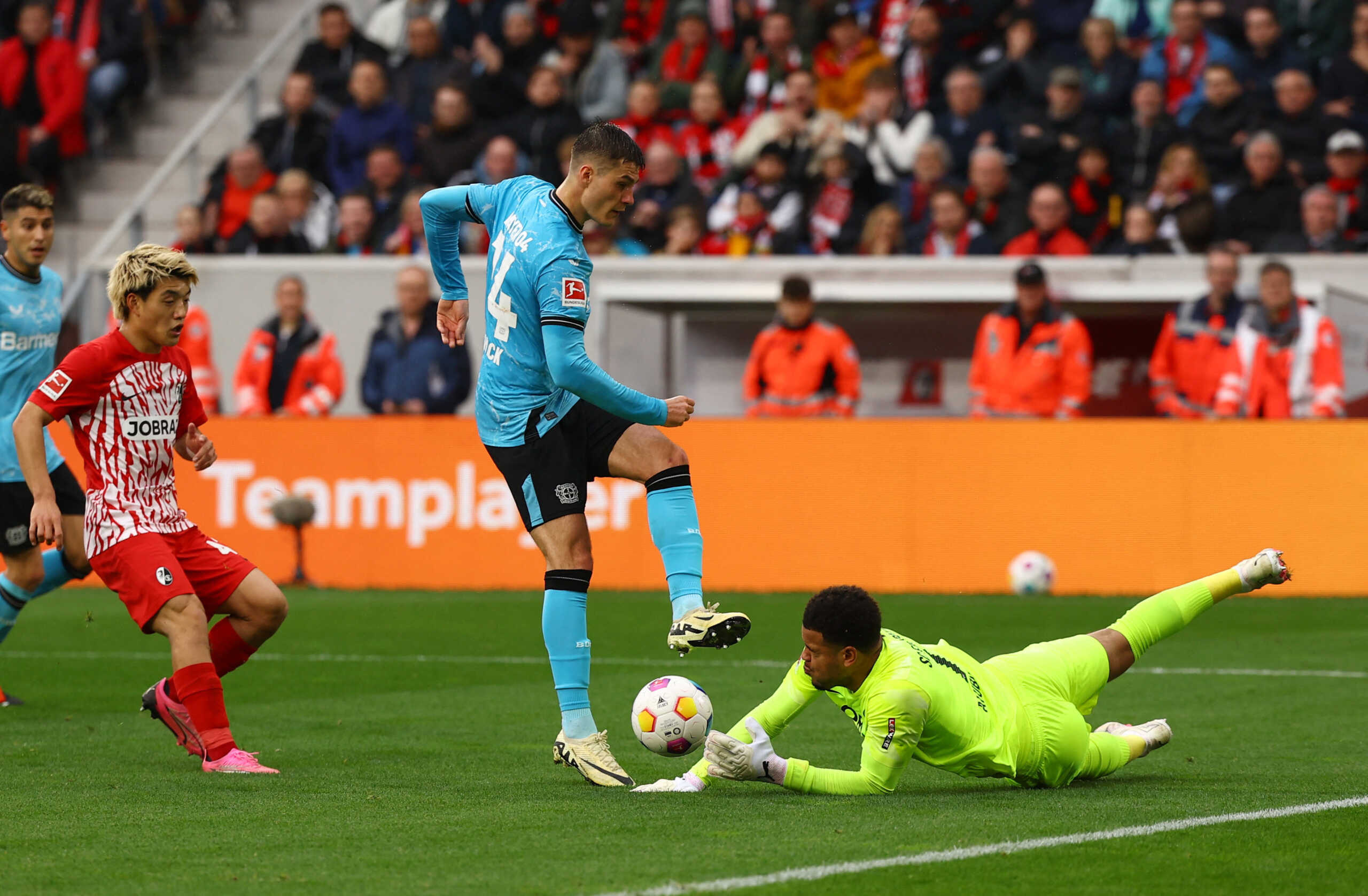 Soccer Football - Bundesliga - SC Freiburg v Bayer Leverkusen - Europa Park Stadion, Freiburg, Germany - March 17, 2024 Bayer Leverkusen's Patrik Schick in action with SC Freiburg's Noah Atubolu REUTERS