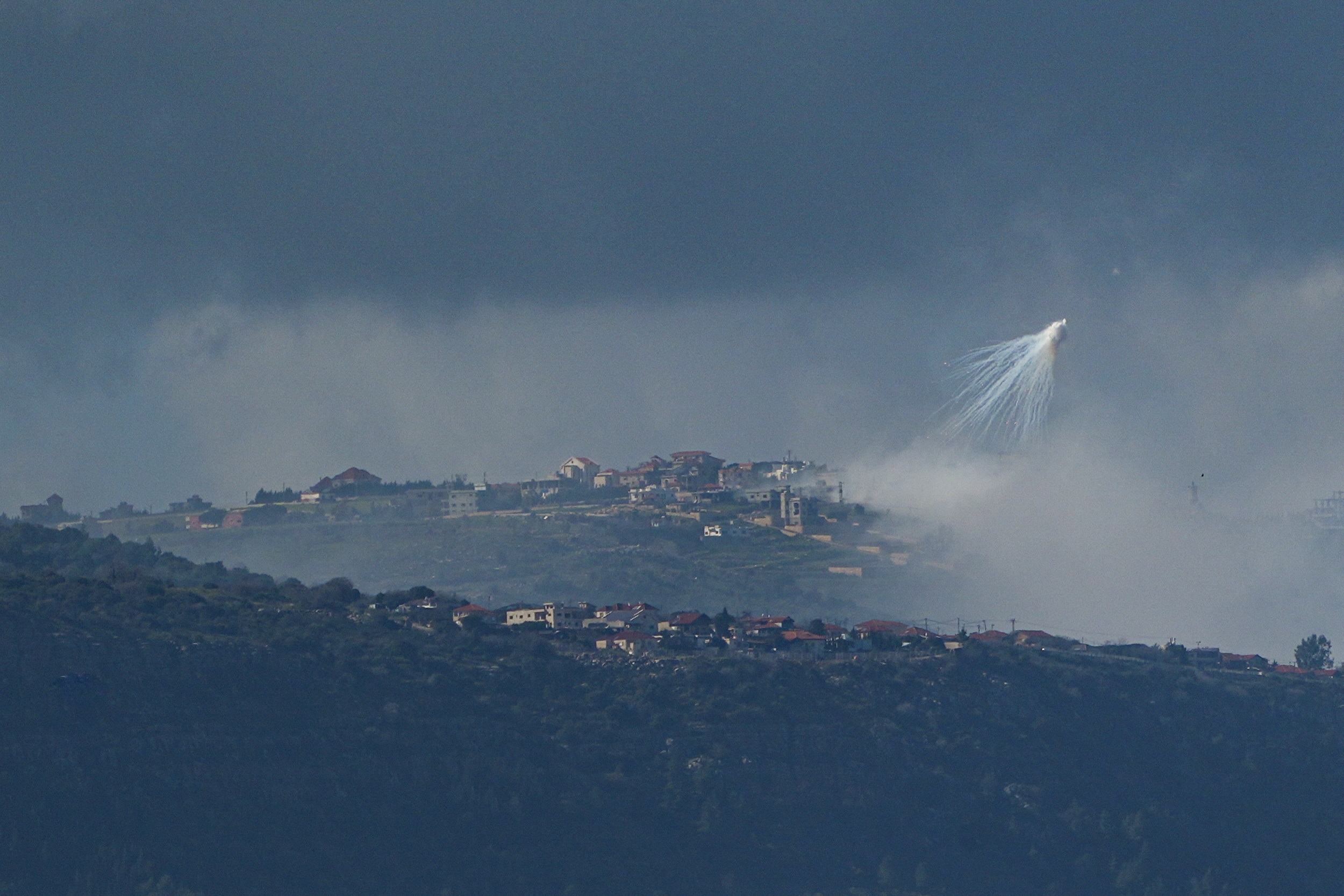 The Israeli army uses white phosphorus to create a smoke screen in Lebanon, as seen from Israel’s border with Lebanon in northern Israel, March 4, 2024. REUTERS