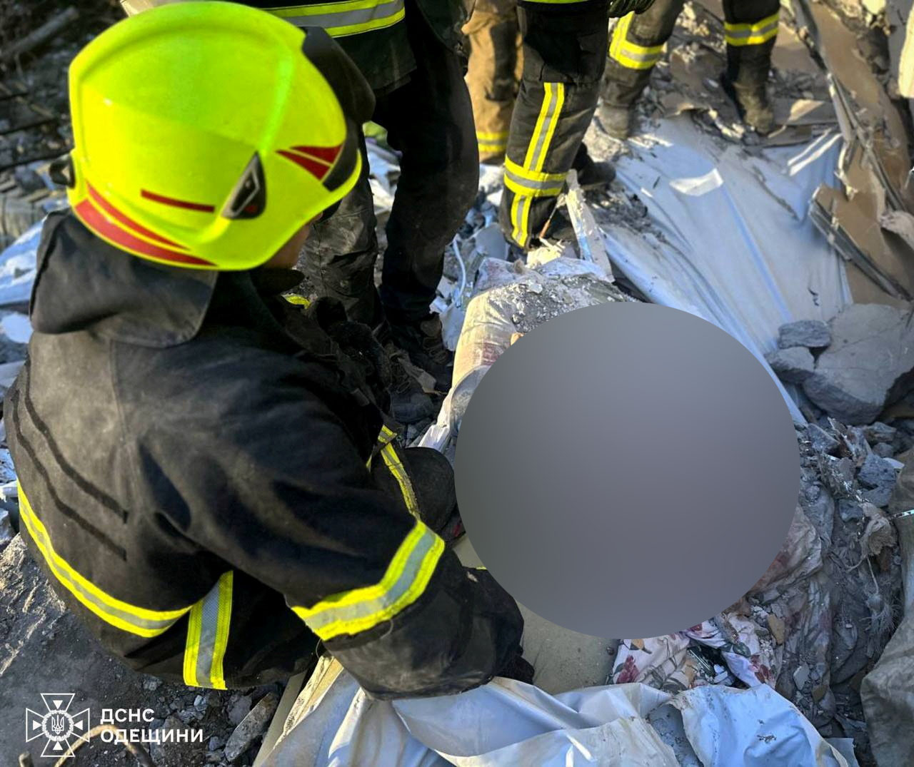 SENSITIVE MATERIAL. THIS IMAGE MAY OFFEND OR DISTURB Rescuers extract the bodies of a mother and her son from debris at the site of a residential building damaged by a Russian drone strike, amid Russia's attack on Ukraine, in Odesa, Ukraine March 2, 2024. Press service of the State Emergency Service of Ukraine in Odesa region